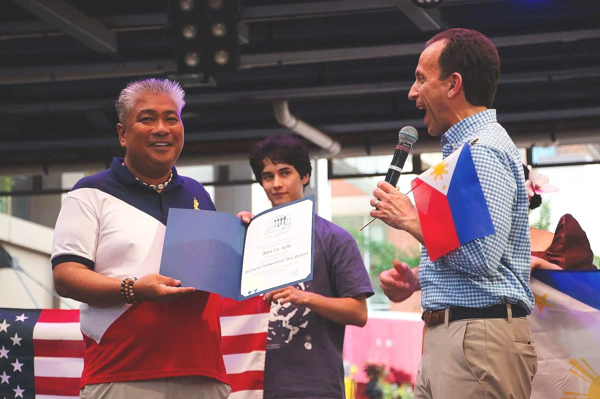 Executive Director of Crane House Joel Buno accepts proclamation from Mayor Craig Greenberg. (Photo by McKenzie Gary, 2026)