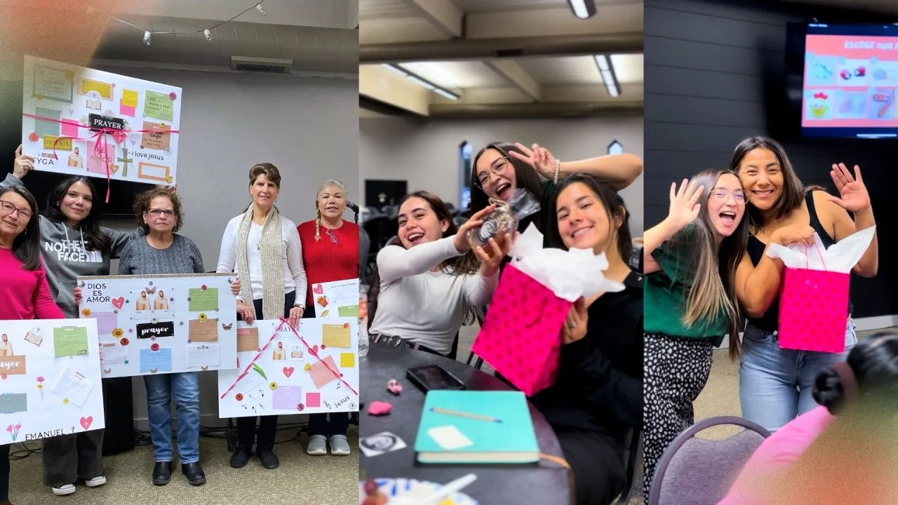 Group of women celebrating indoors with posters, gifts, and hugs, smiling and making peace signs.