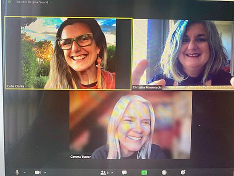 Screenshot of a video call with three women, all smiling. reflective of COVID years when rehearsals and meeting all took place online. Three female singers rehearsing online