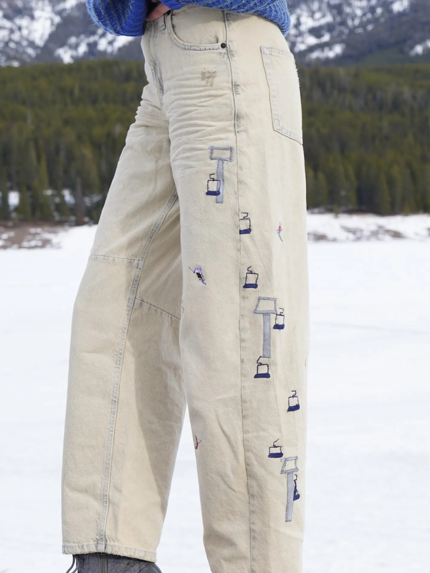 Ski Resort Pants! Found these super cool white washed barrel jeans and immediately knew they needed some skiers. Chair lifts made from suede scraps and hand embroidered! Skiers and snowboarder I hand drew and my embroidered machine did an amazing job