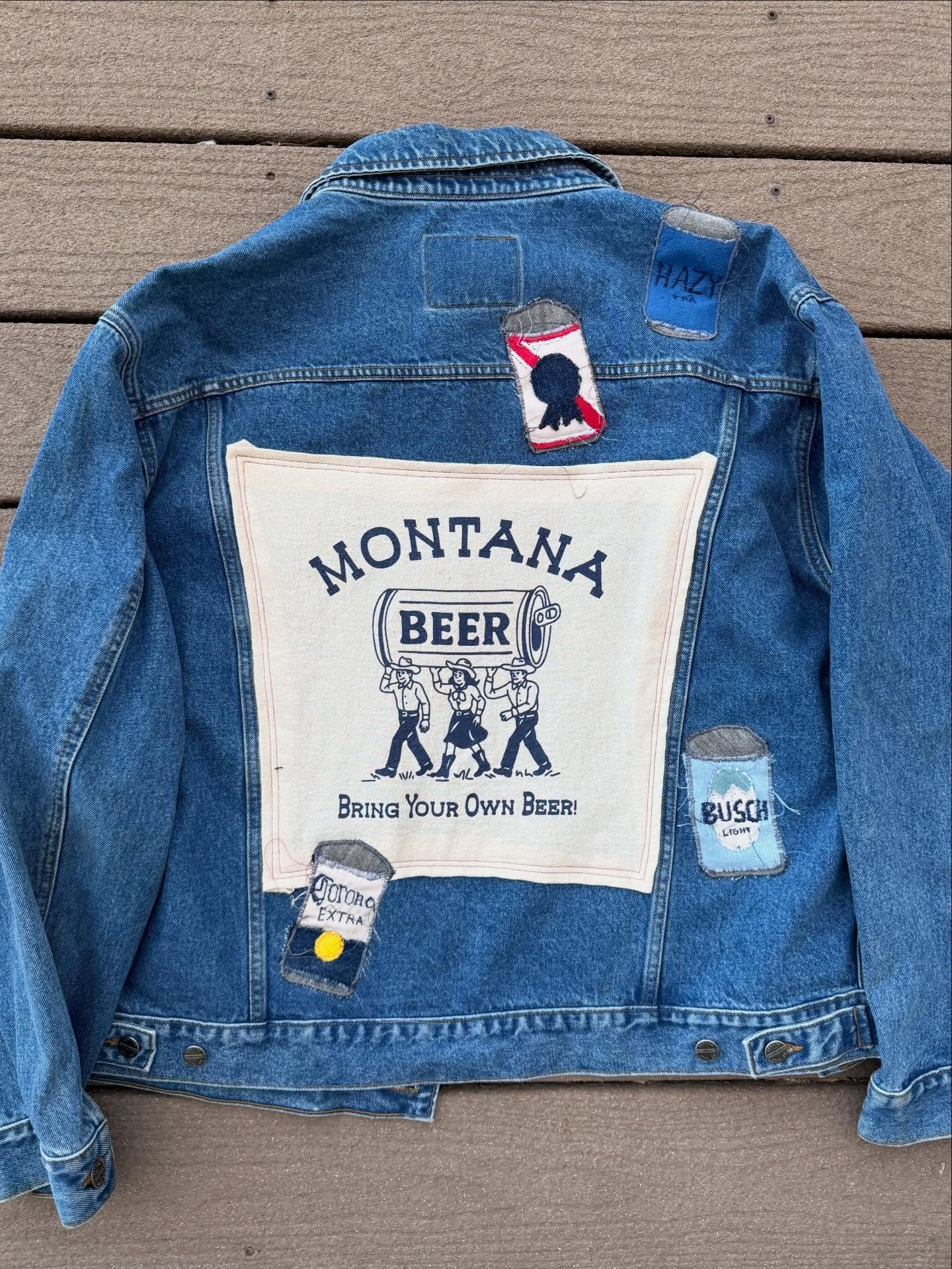 This beer jacket found a new home yesterday! Upcycled this cute dish towel from @intrigueink and free hand embroidered all the beer cans from fabric scraps :) 
&bull;
&bull;
&bull;
#beer #upcycle #montana #denim #handmade