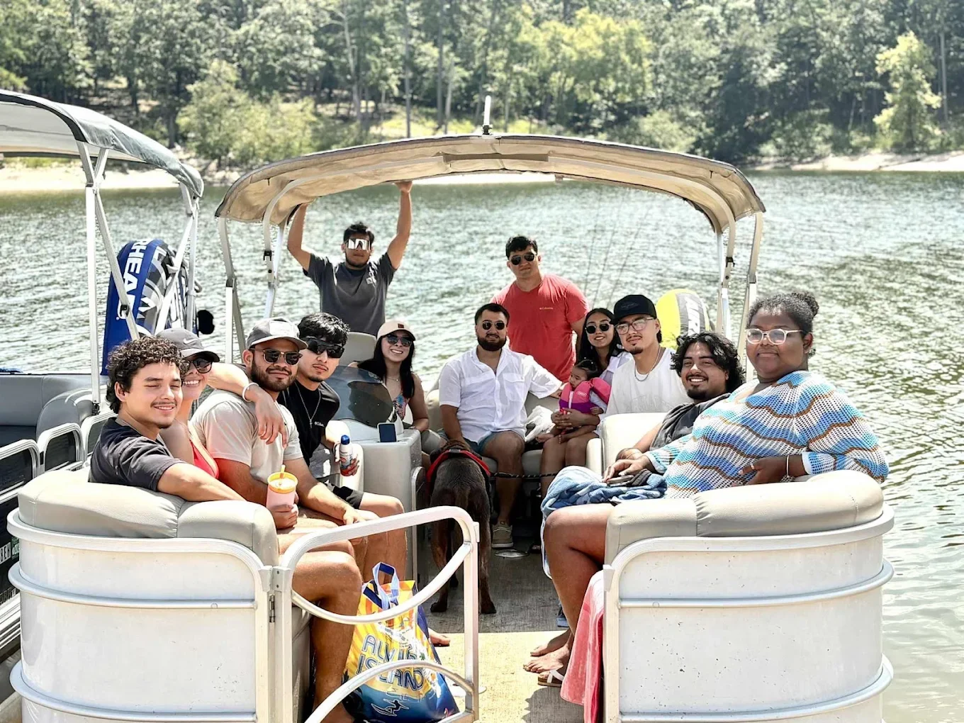 Friends and family enjoying a day on the water at Broken Bow Lake/Hochatown thanks to Hochatown Hills and Thrills Boat Rental