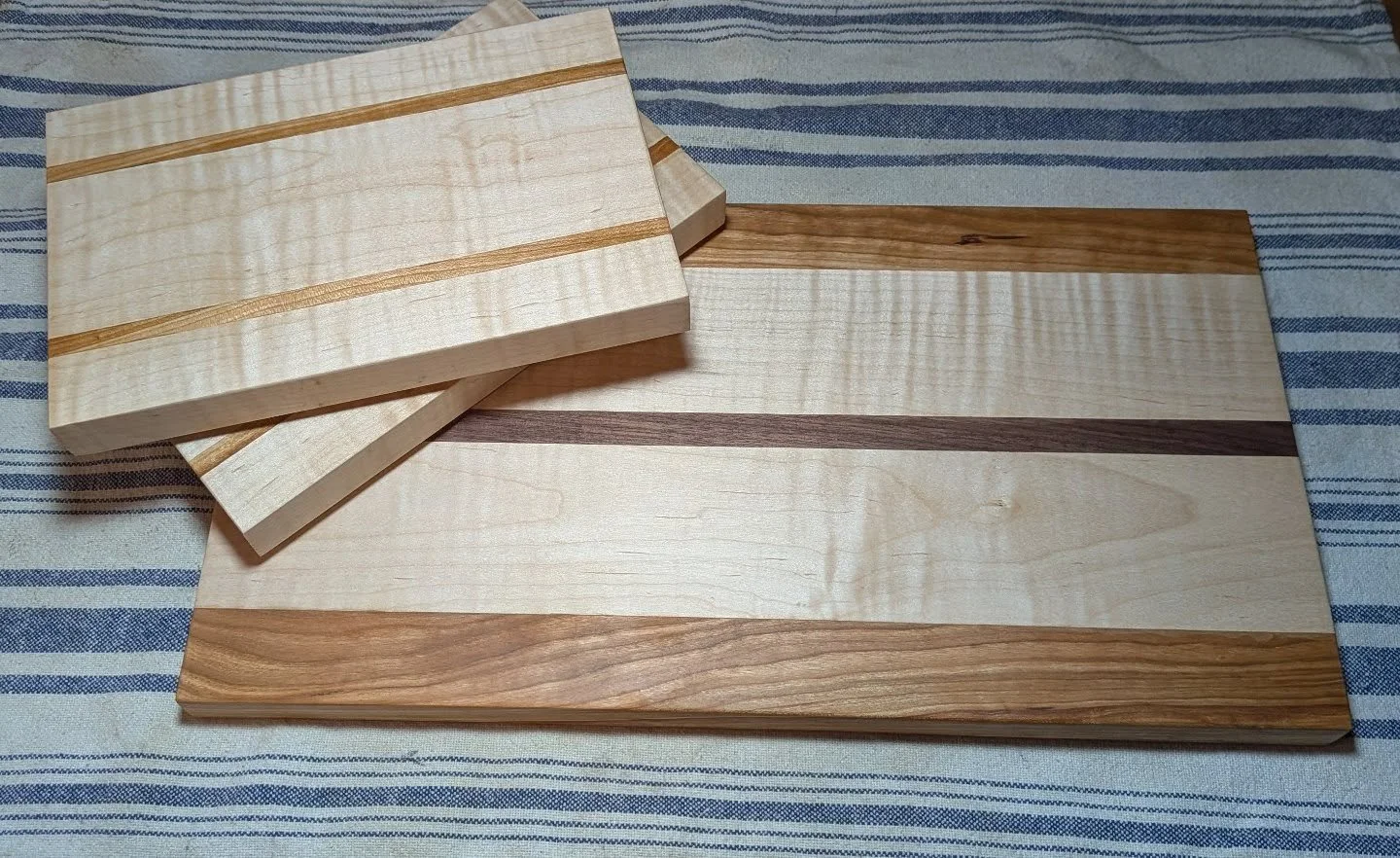 I always enjoy making gifts.  This year I made cutting boards with a lovely piece of curly maple with cherry and walnut accents.  Happy Holidays!