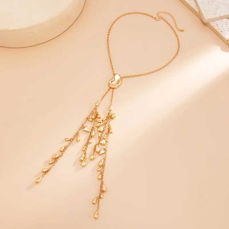 Water-Droplets-Pattern-Long-Necklace-In-Gold-Alloy-With-Heart-Shape-And-Tassel-For-Elegant-Style-3.webp