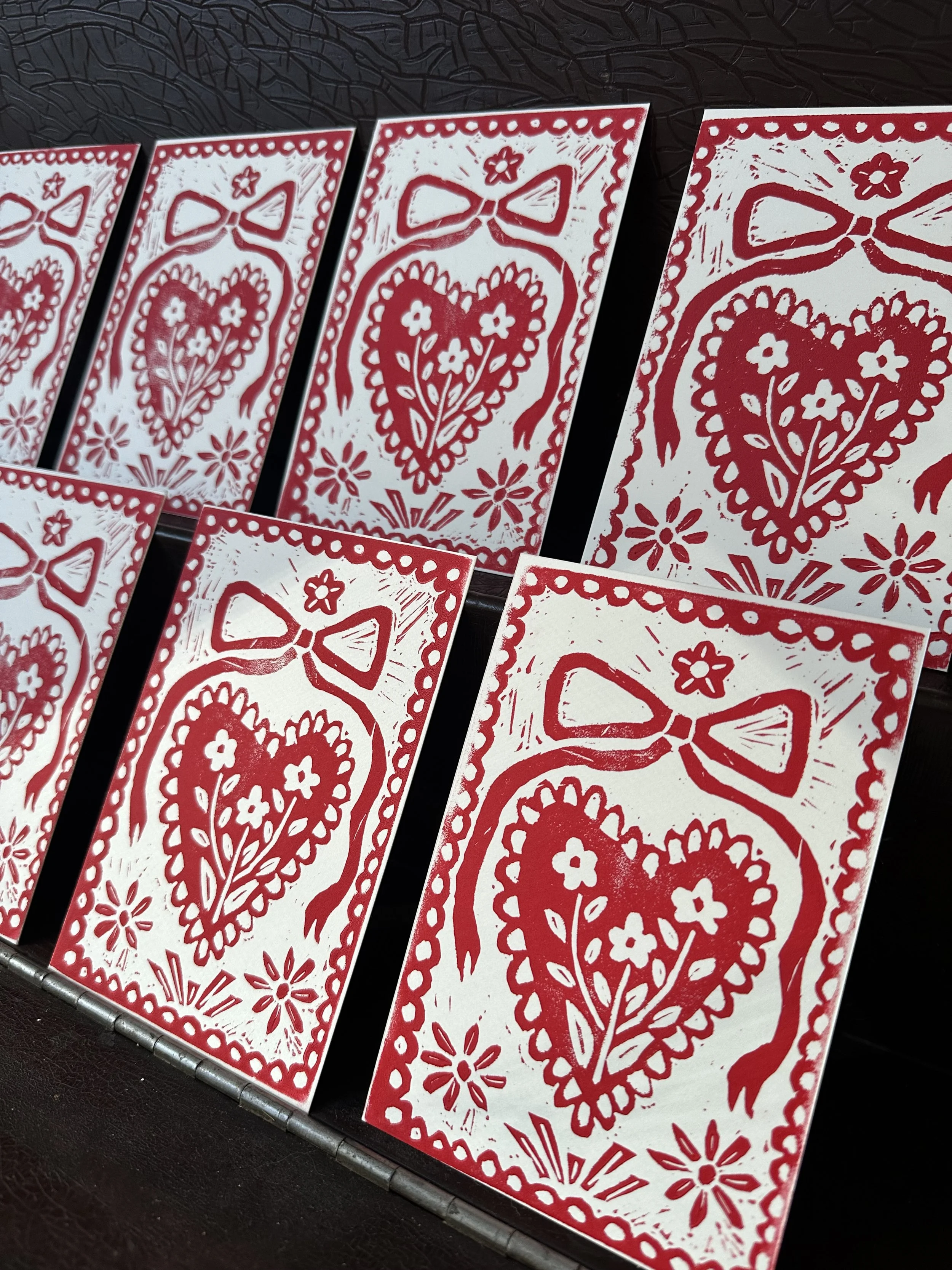 handmade red heart linocut print with scalloped doily border inspired by Scandinavian folk art.