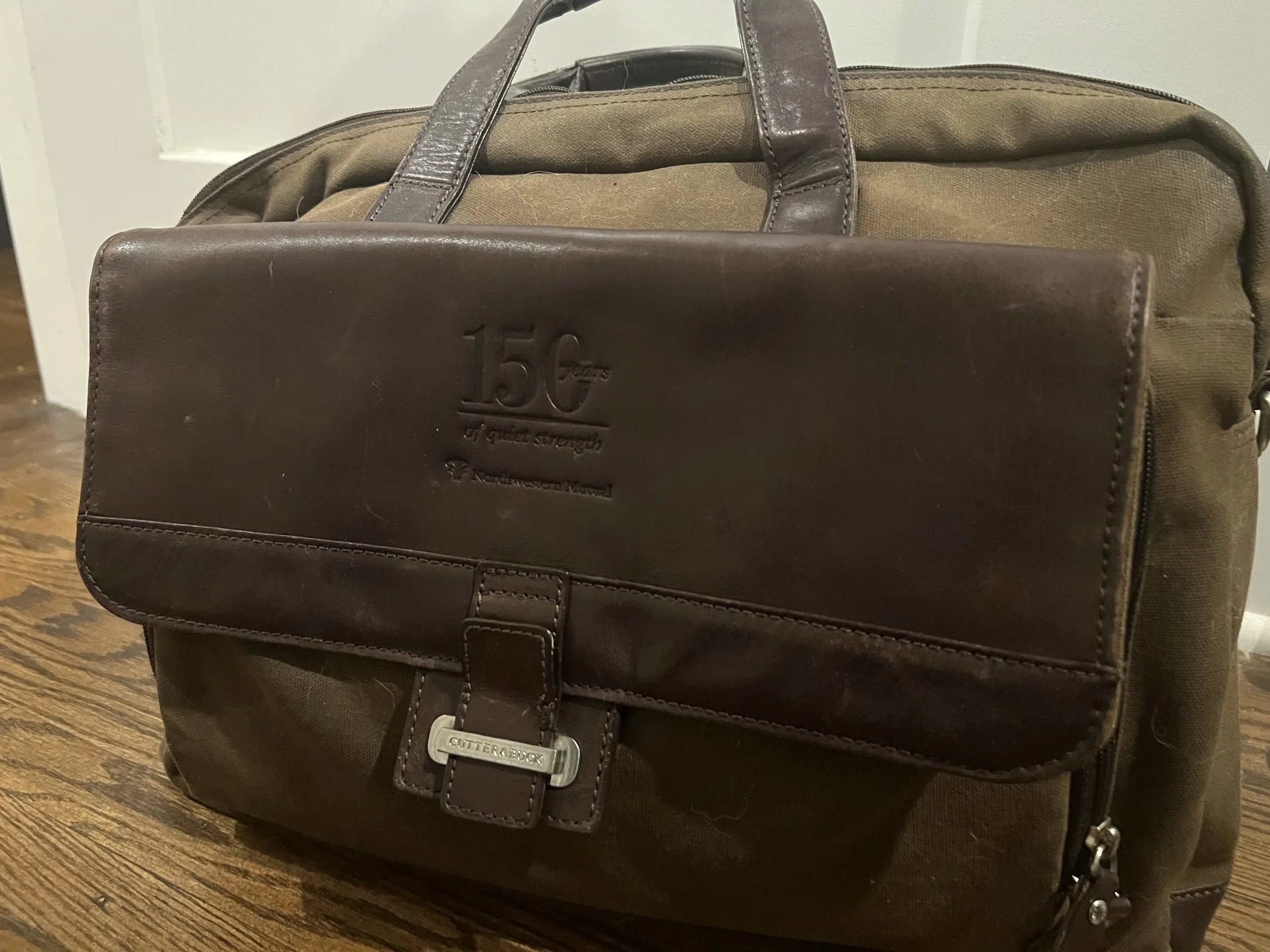 Brown computer bag celebrating Nortwestern Mutual's 150th Anniversary 150
