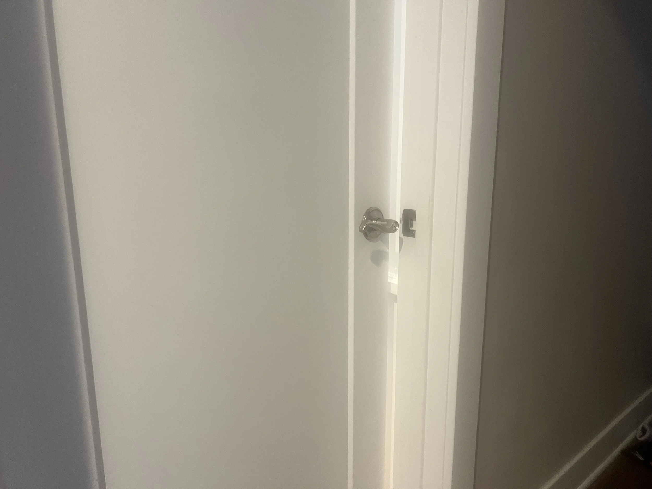 White office door slightly ajar