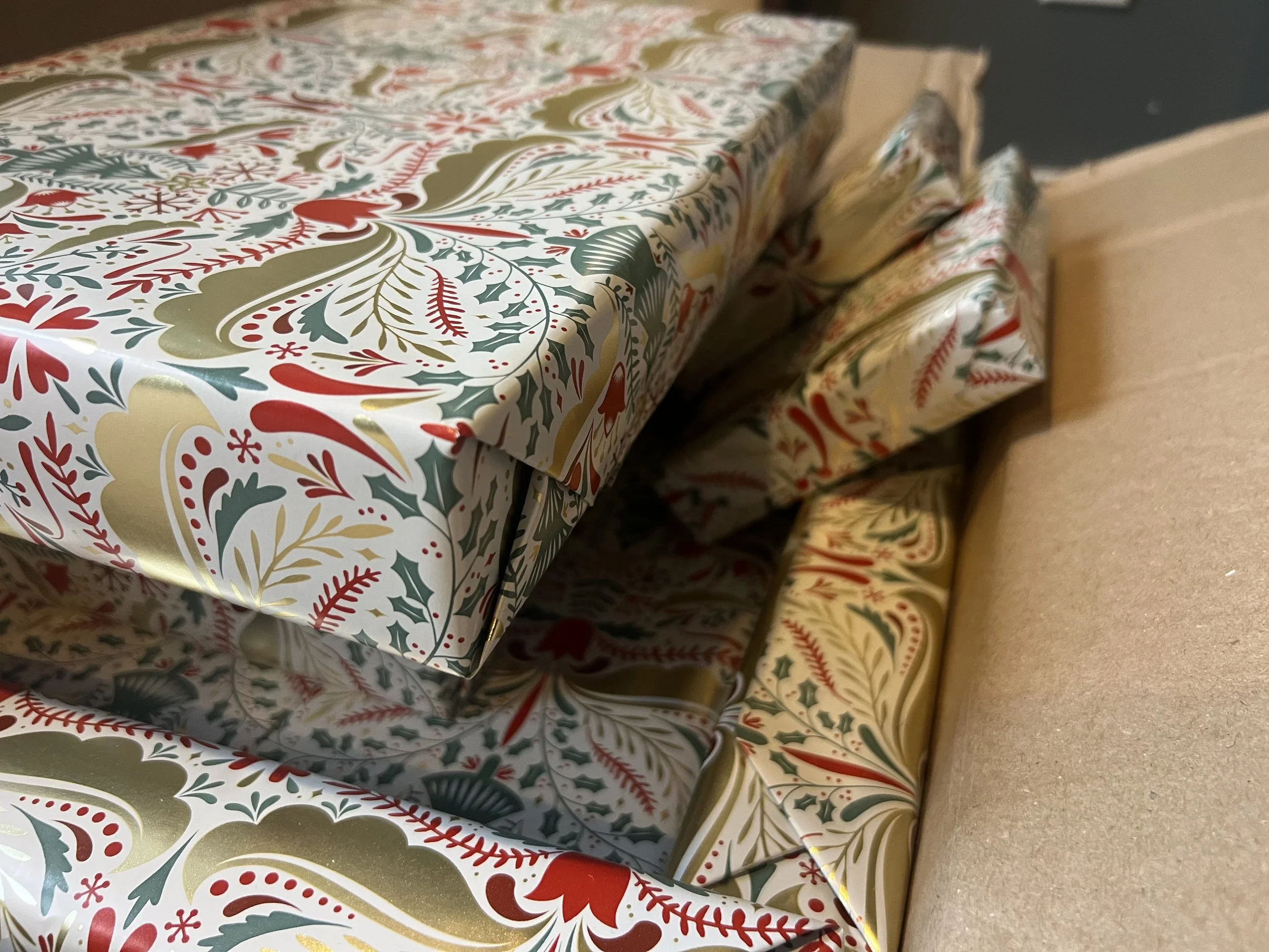 A box of wrapped Christmas presents