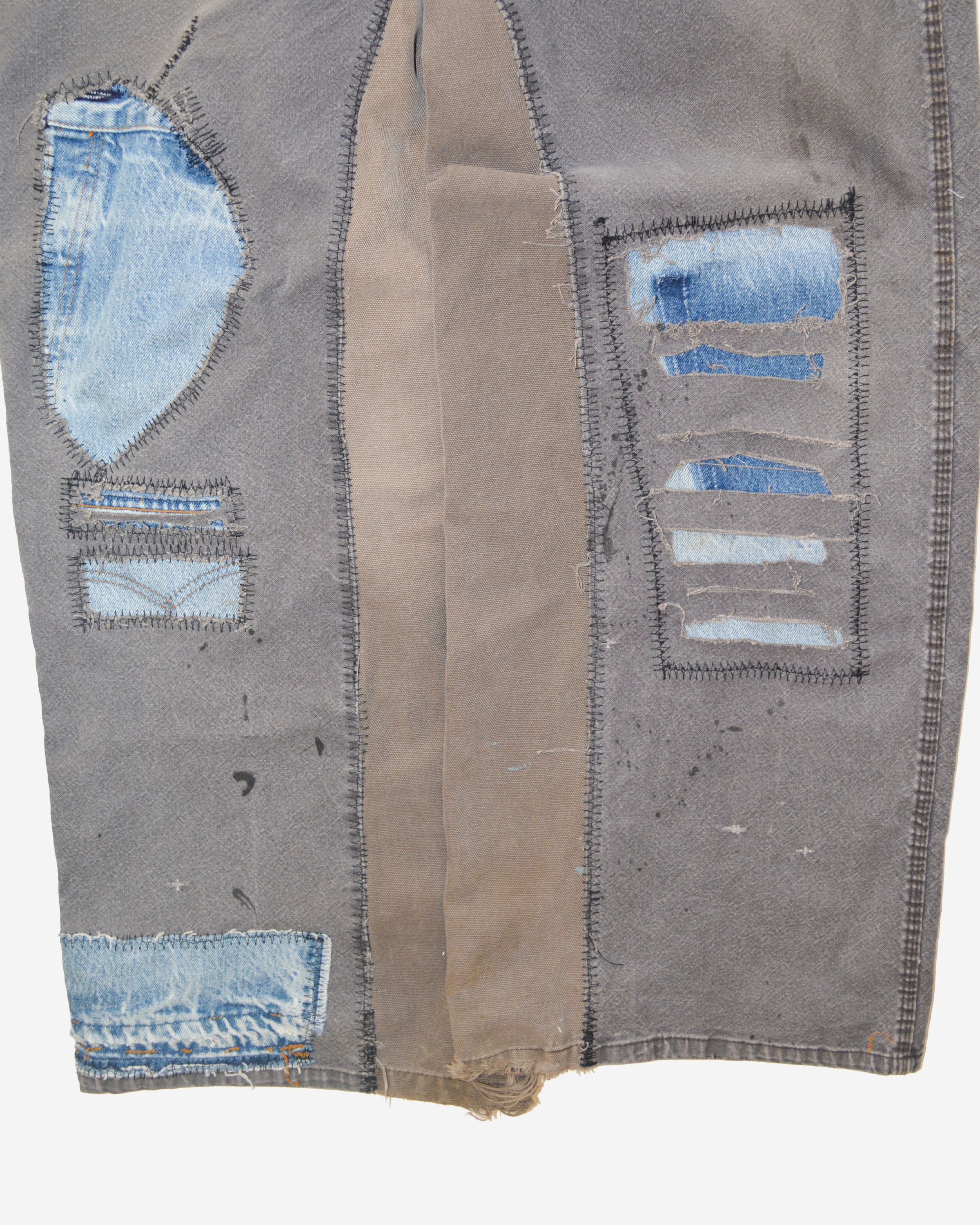 Brown pants front details close up.png