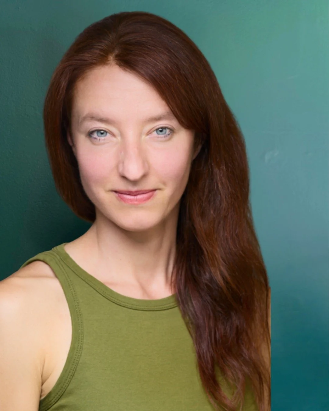 Kasia Krasnopolska, Pilates instructor at Hell's Kitchen Pilates, smiling in the studio.