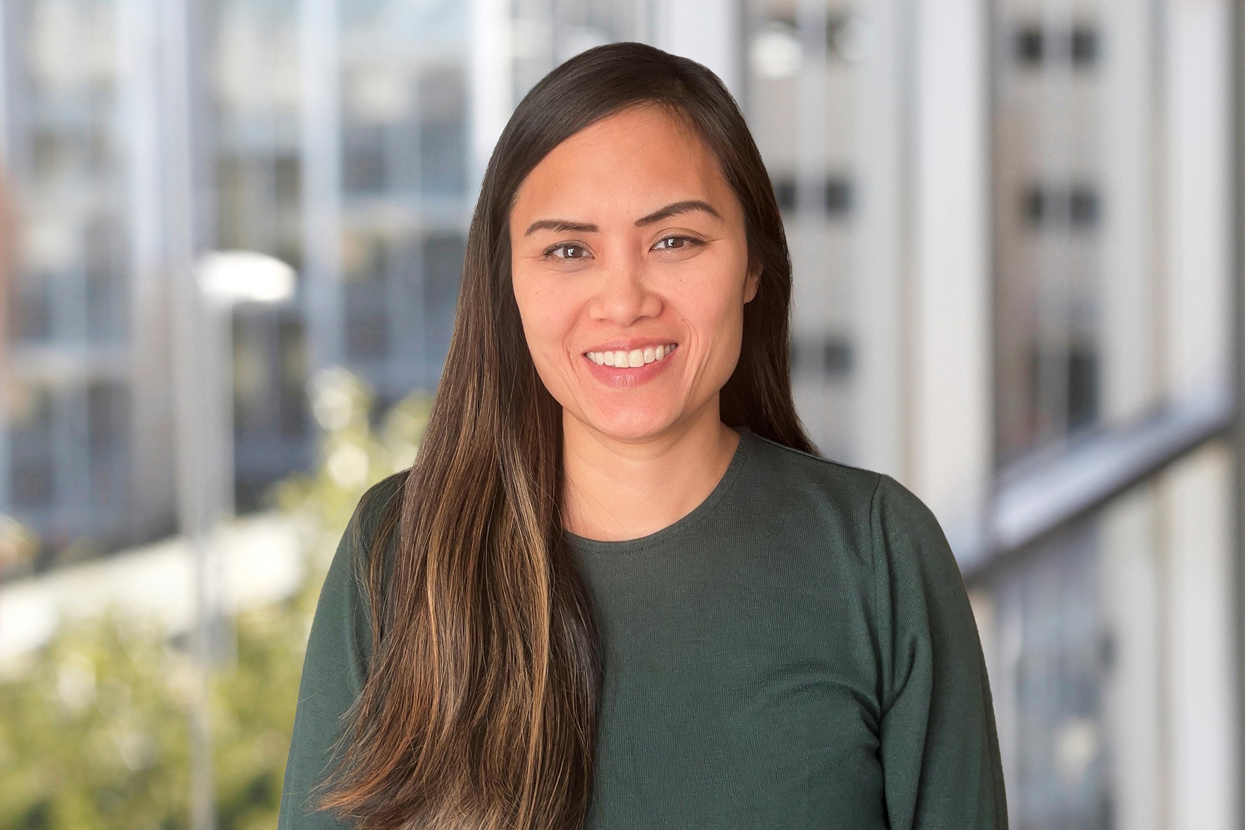 A photograph of a woman smiling.