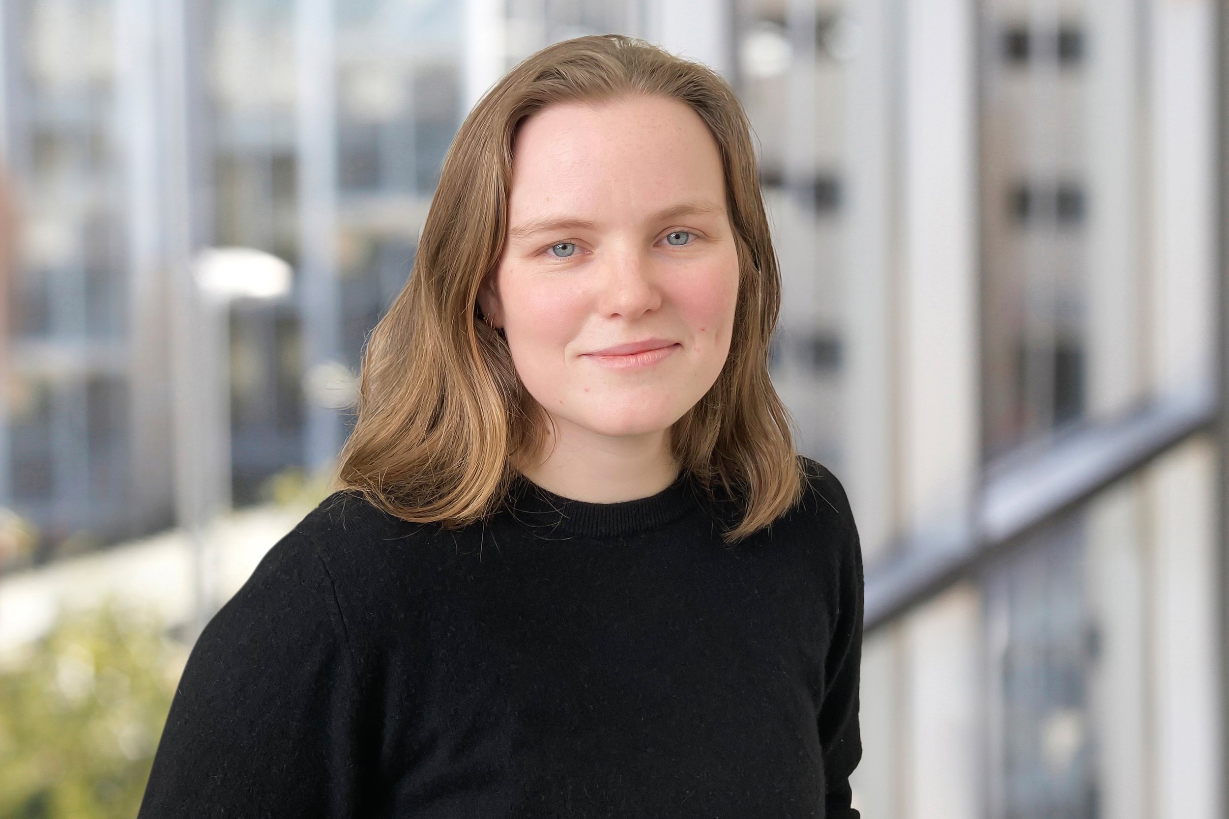 A portrait of a woman with shoulder-length hair.