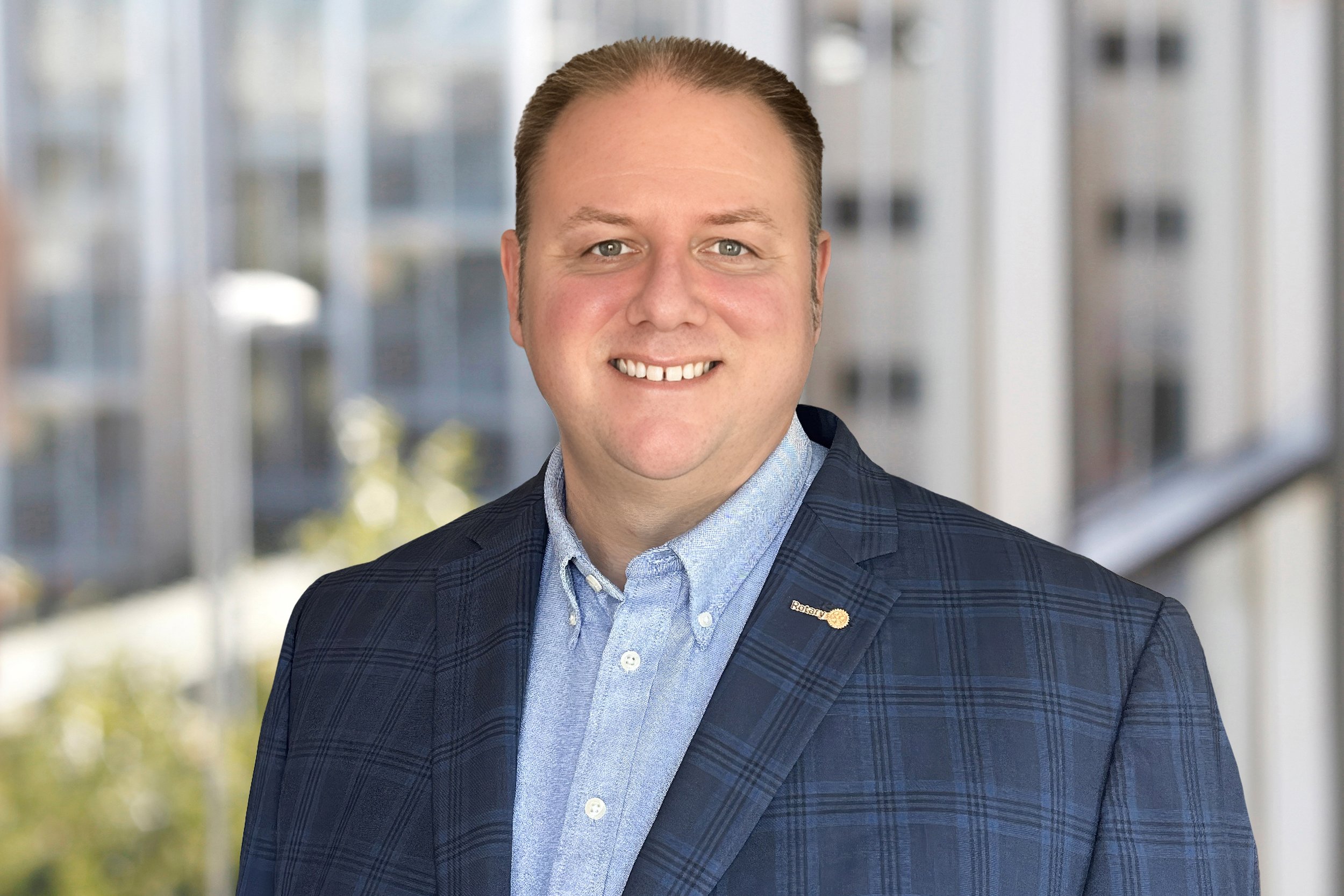 Color portrait of a smiling man in a suit