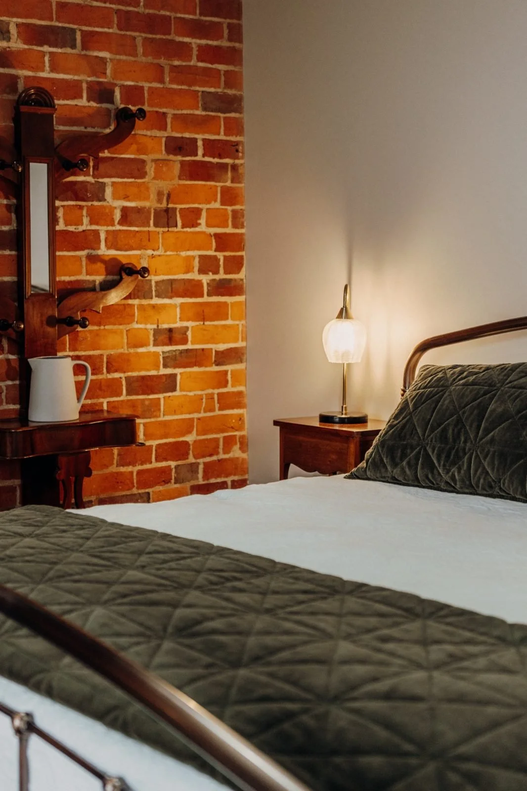 Beautifully appointed bedroom in the Coach House at Rawson Park Homestead near Wagga Wagga, NSW, featuring a luxurious king-sized bed and elegant country-style accommodation.