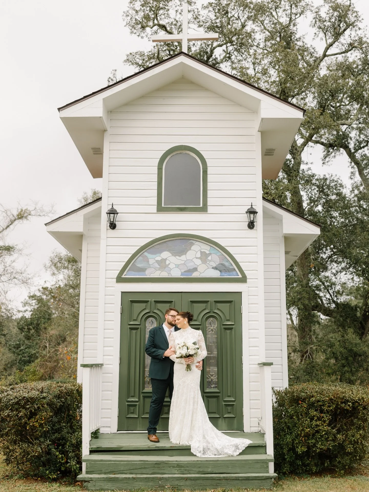 A quiet moment for the newlyweds outside the chapel at Oak Crest Mansion Inn &mdash; where timeless charm and beautiful grounds create the perfect setting for your &ldquo;I do.&rdquo;

Ready to start your own forever? ✨
Inquire today to tour the venu