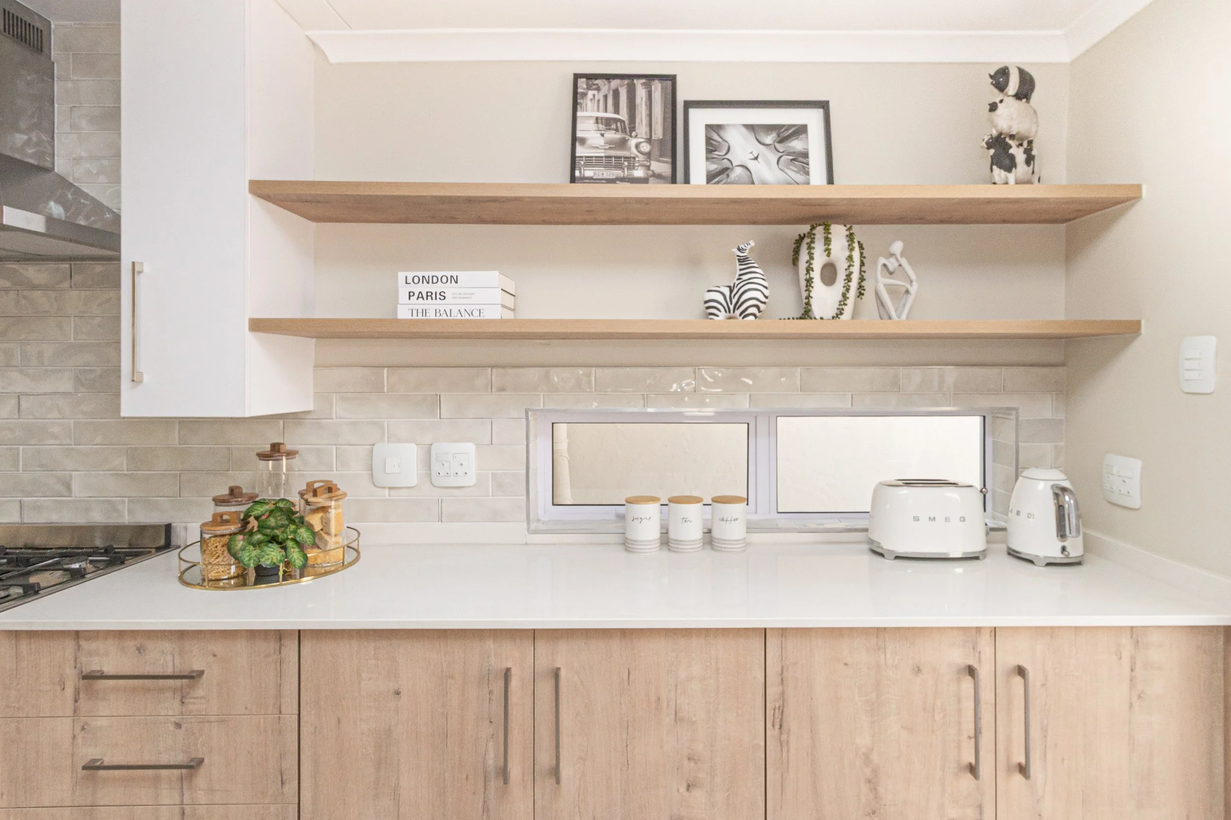 contemporary kitchen with oak finishes and floating shelves