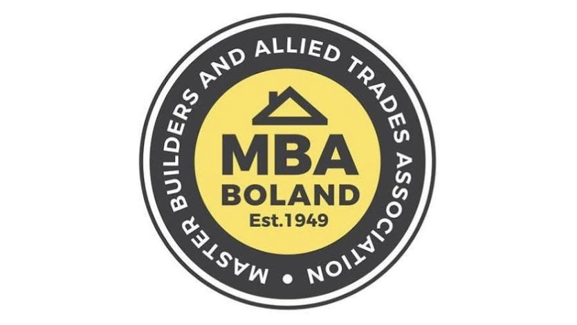 Logo of MBA Boland with a yellow circle, a black house roof symbol, and black text that reads "MBA Boland Est. 1949", surrounded by black text that reads "Master Builders and Allied Trades Association".