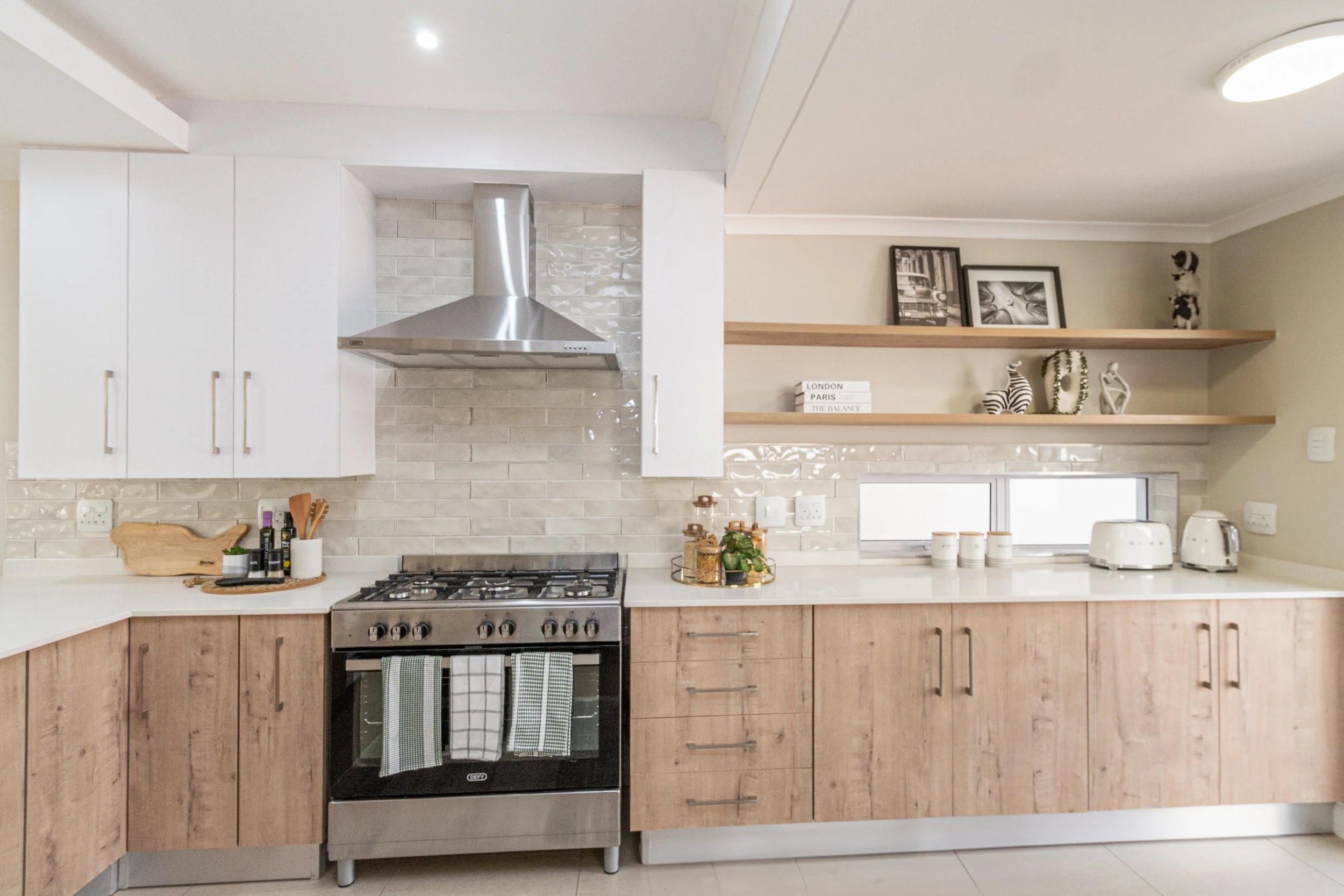 contemporary kitchen with oak finishes and floating shelves