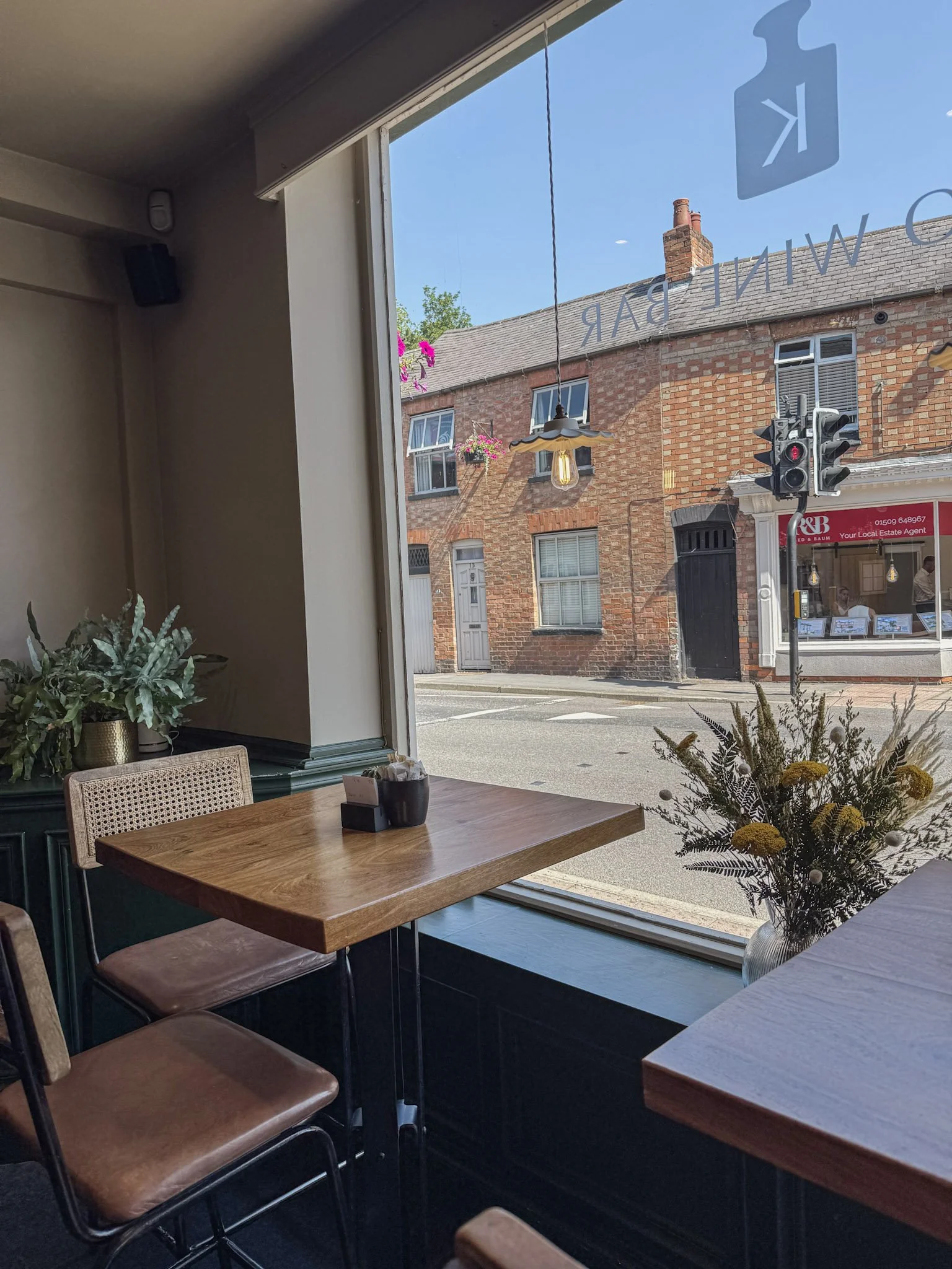 Window seating and floral window display at Kilo Wine Bar