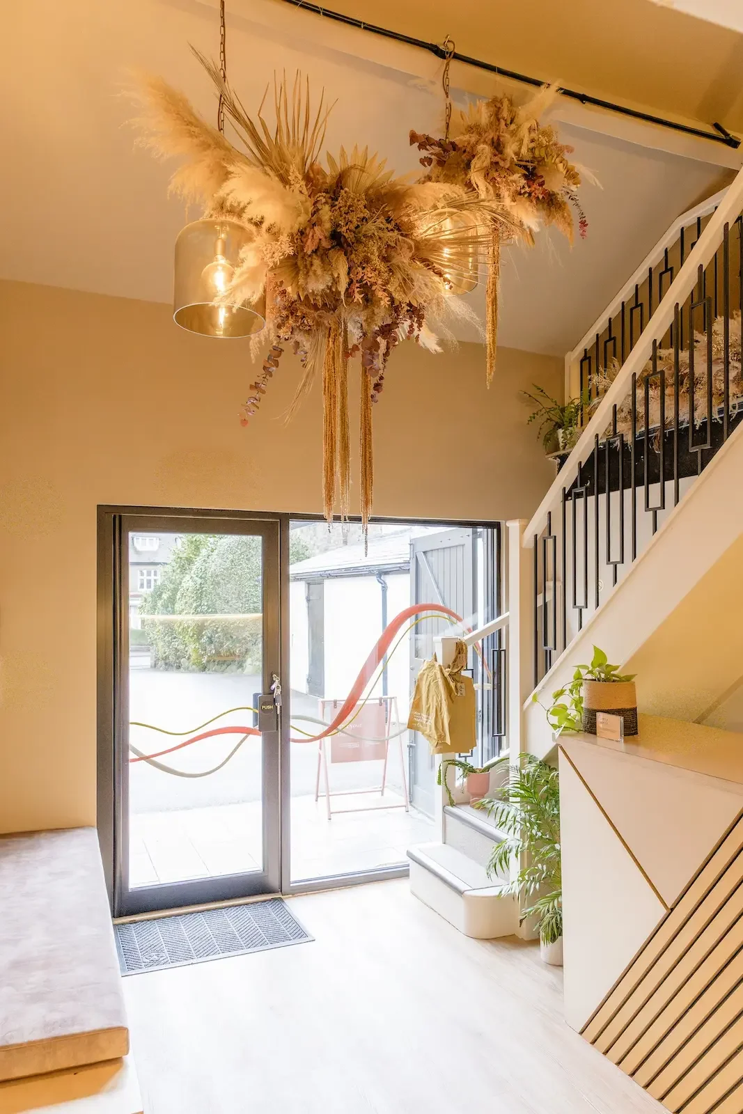 Sculptural dried flower ceiling installation with lights for Sheffield Wellness Clinic Life & Lemons