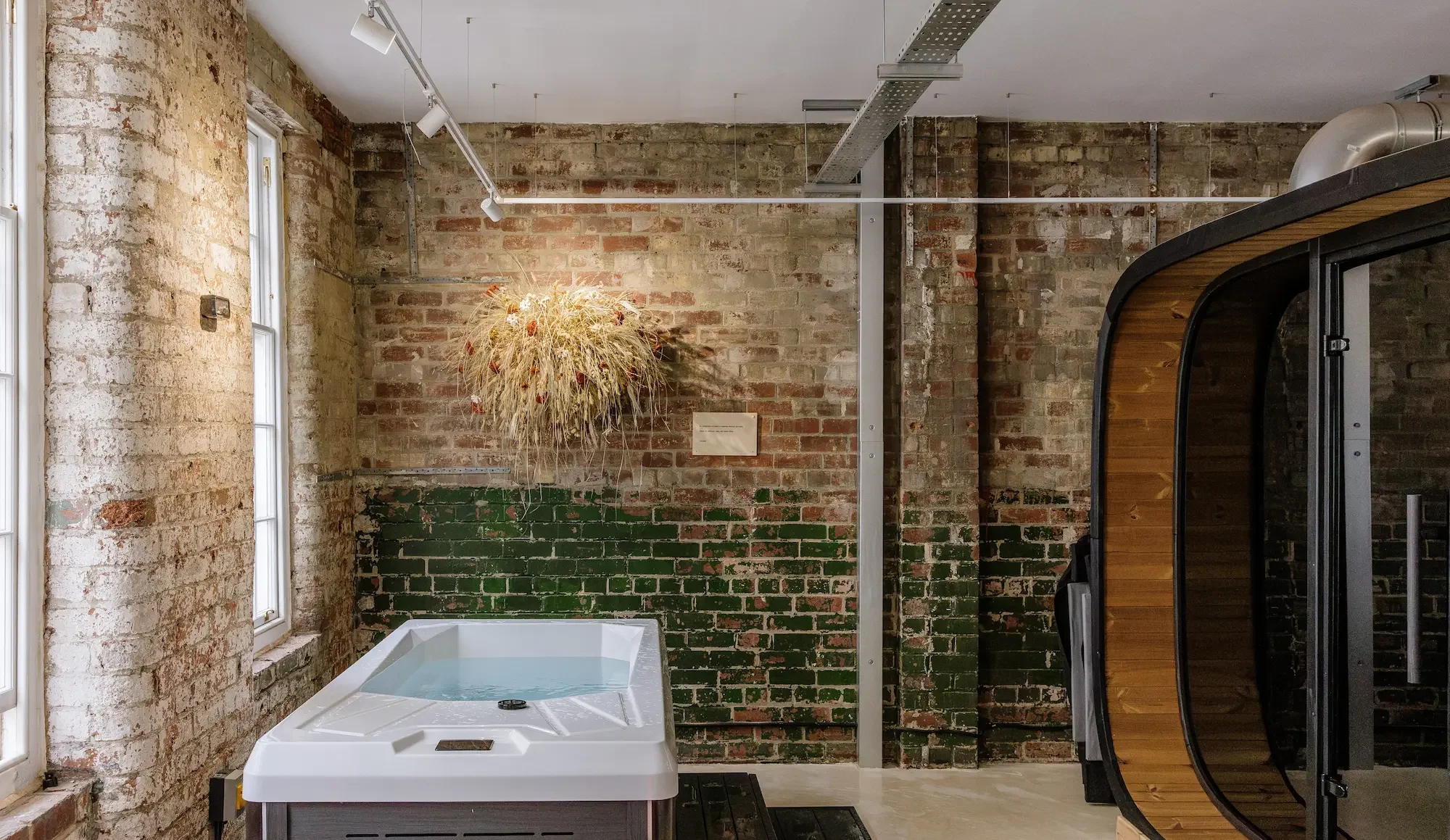 Dried botanical wall installation in the sauna and cold plunge space at Güs Wellness, Sheffield, by Anther Studio