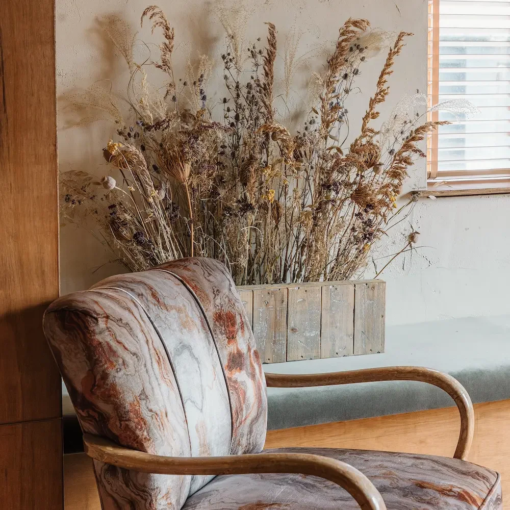 Meadow inspired dried flower display in seating area at The Victoria, Sheffield