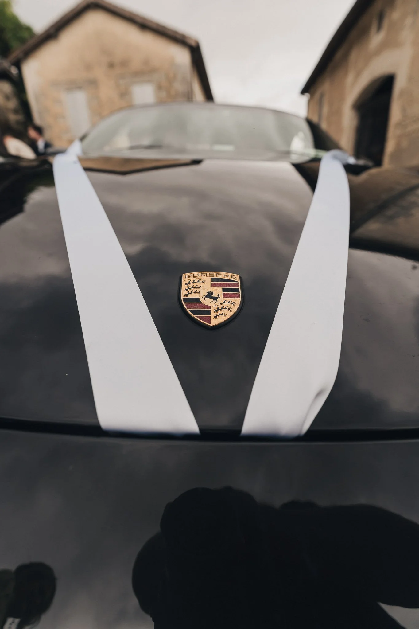 Close-up of the ribboned Porsche bonnet used as the wedding car.