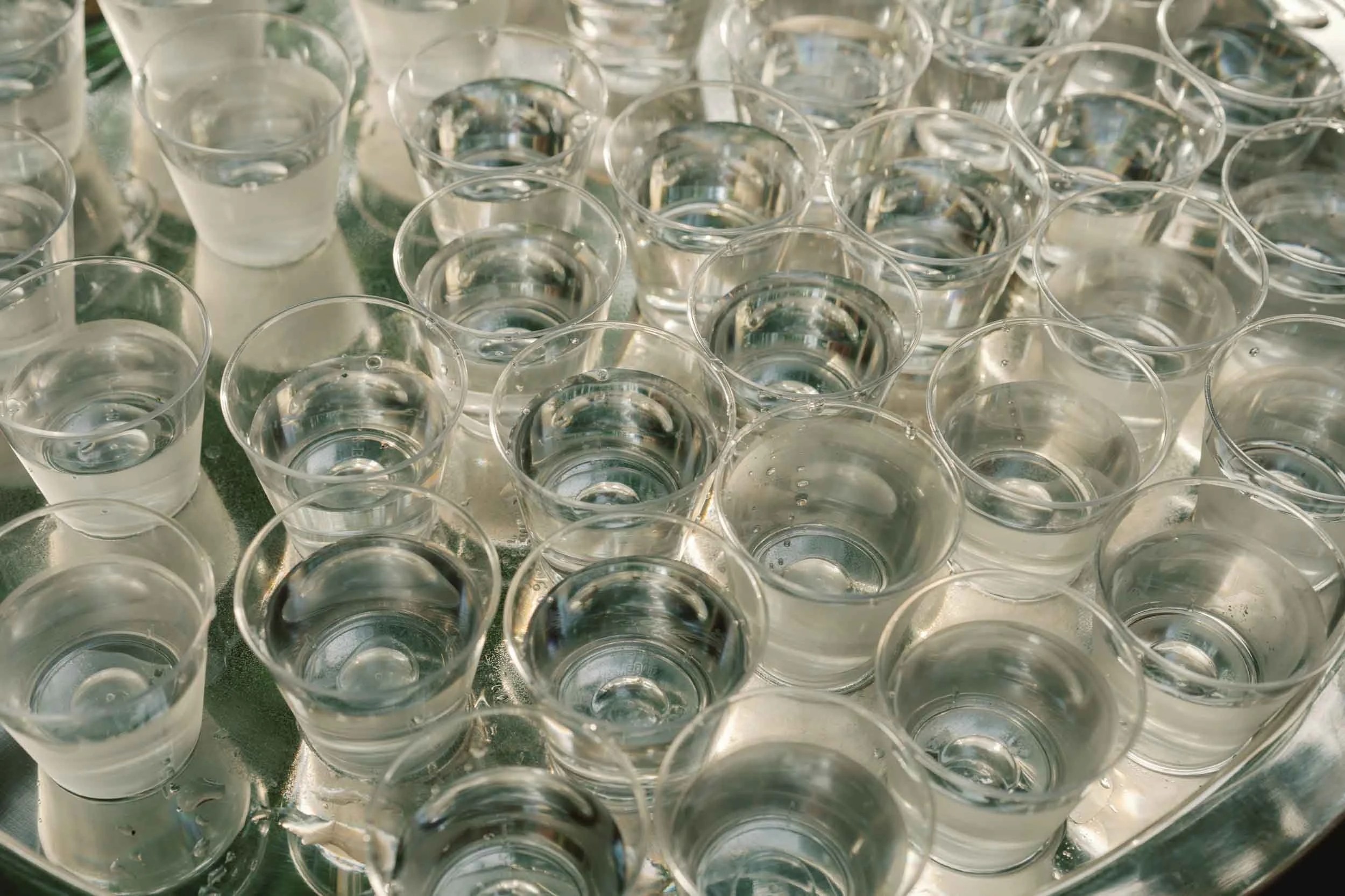 Overhead detail of wedding drinks glasses
