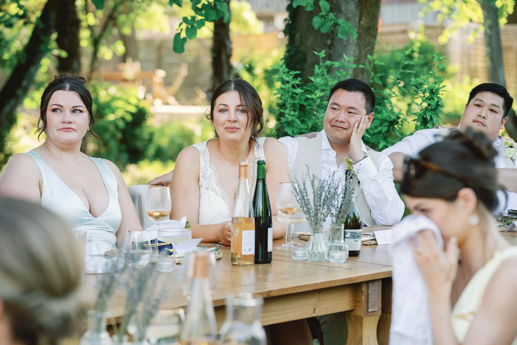 Guests reacting to a wedding speech at Château de Panisseau, Dordogne