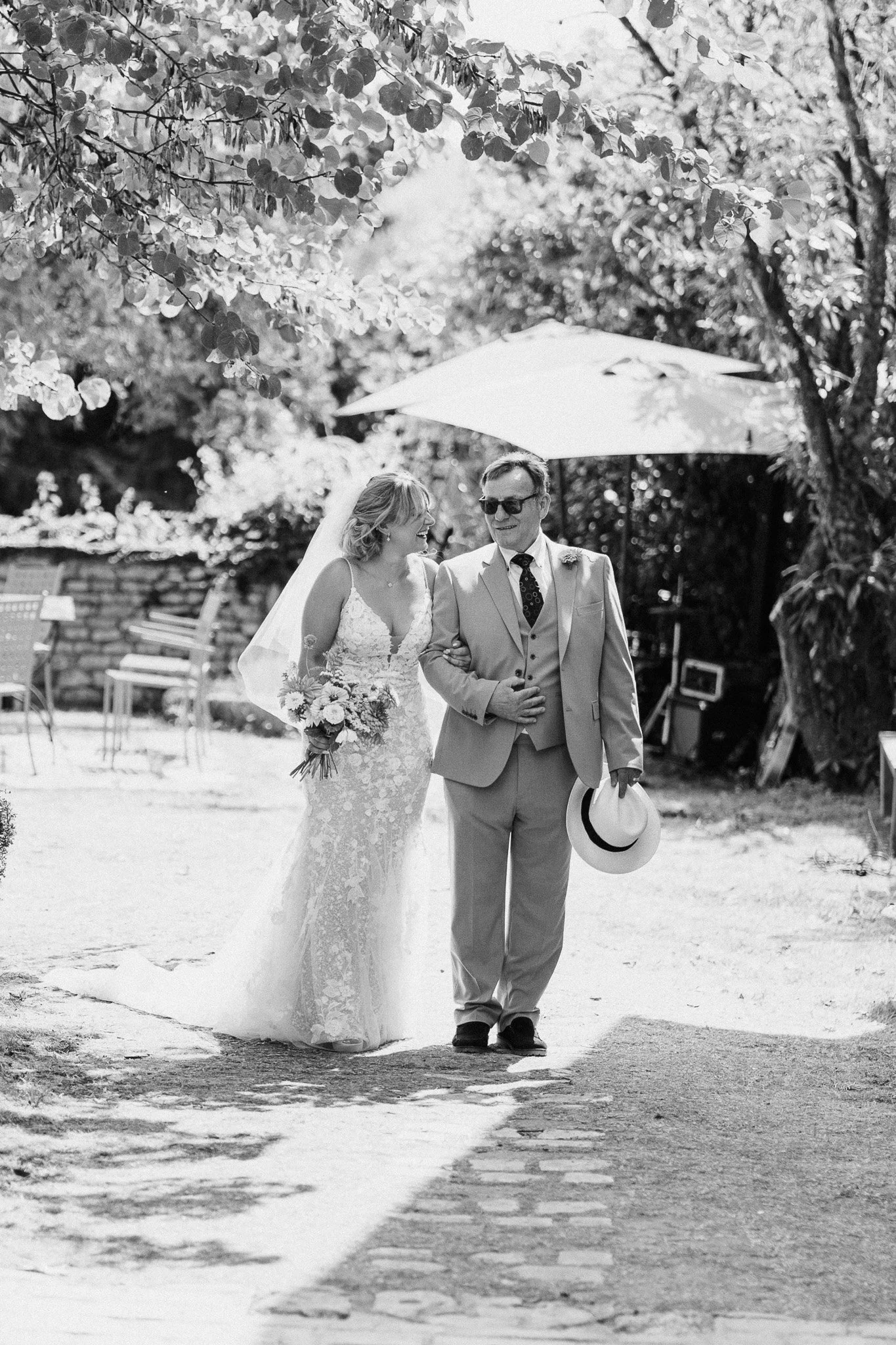 Bride and her father sharing a moment together before walking down the aisle.
