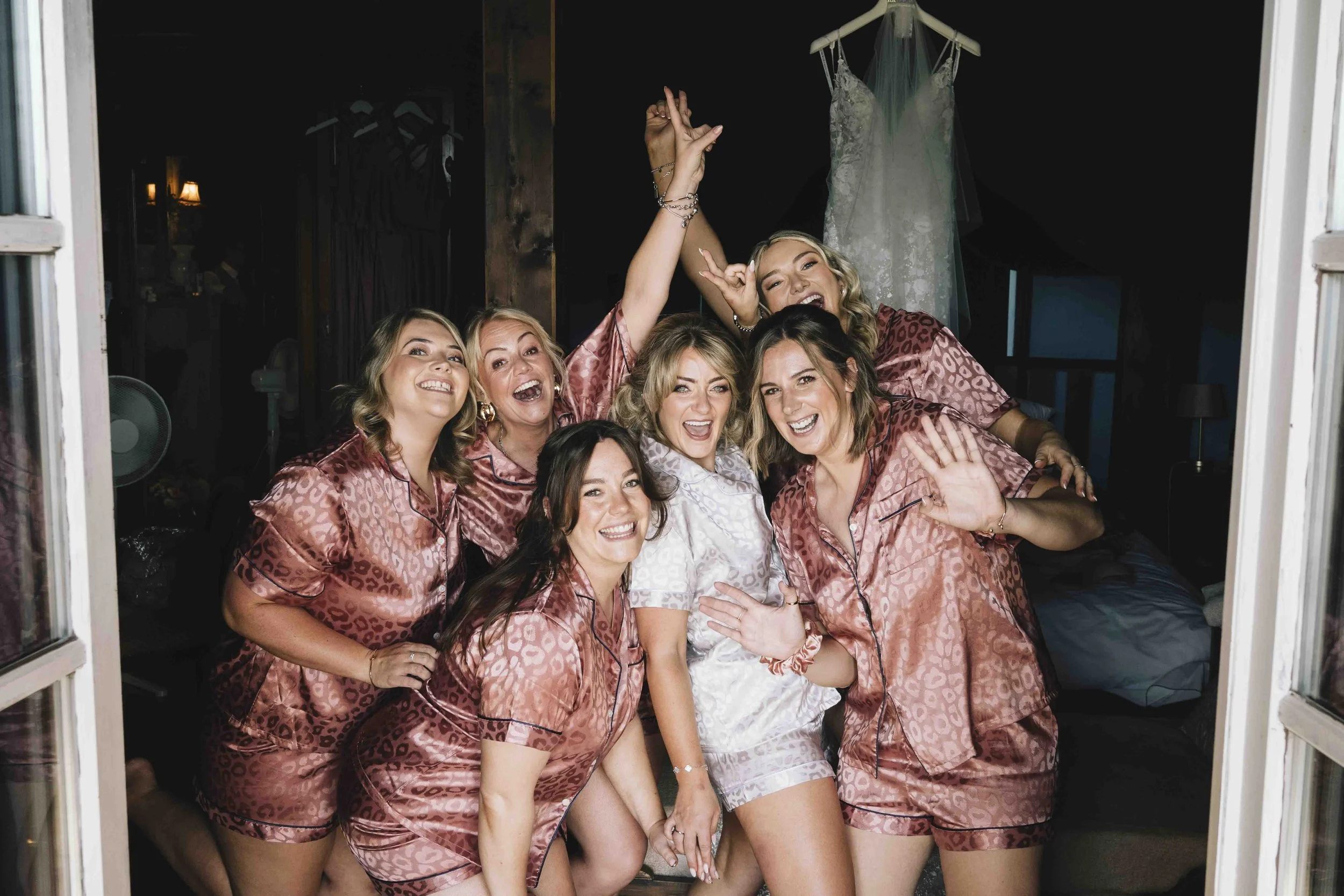 Bride with her bridesmaids in matching pyjamas on the morning of a château wedding in southwest France