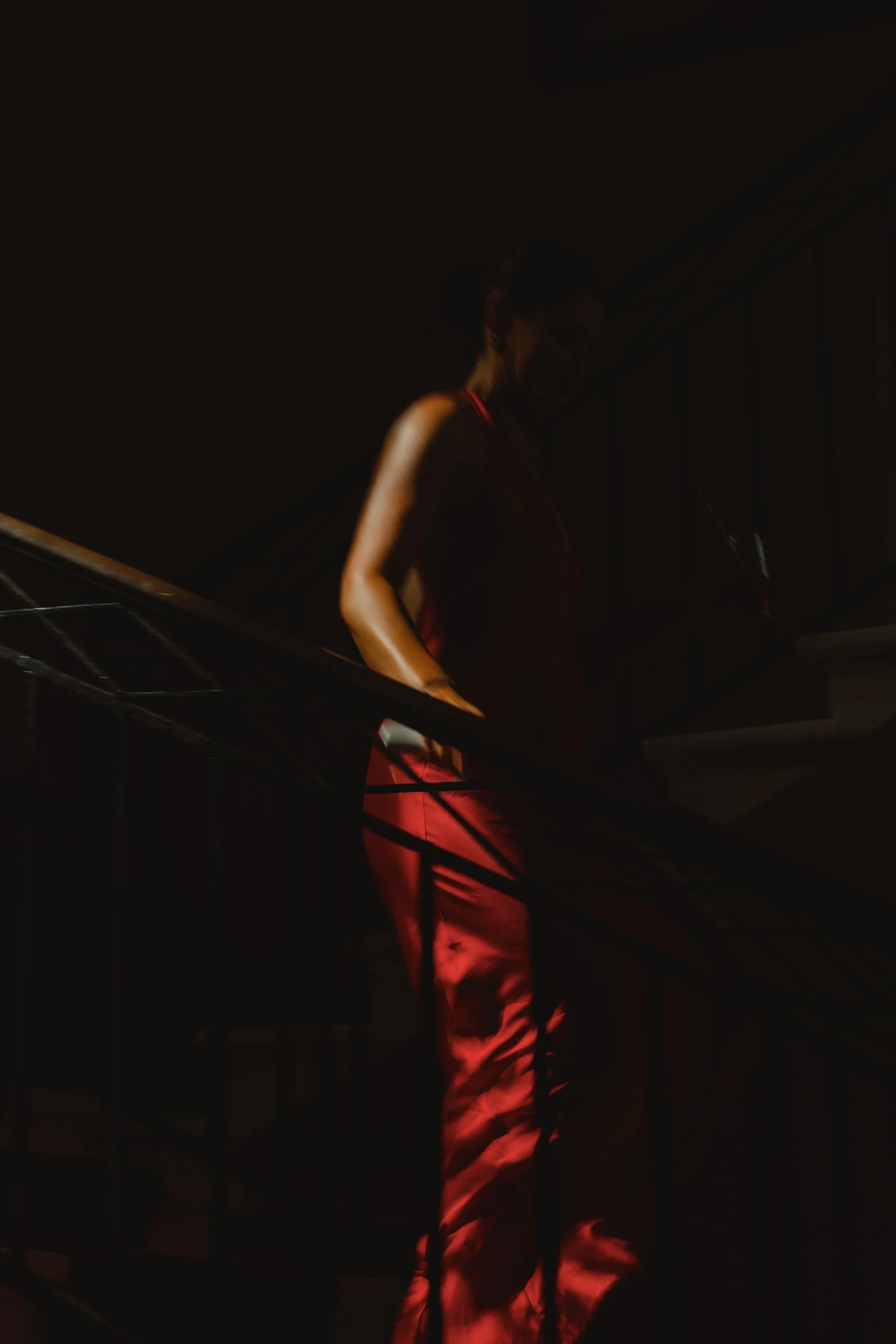 Silhouette of a guest in a red dress at Château Lagorce, Bordeaux