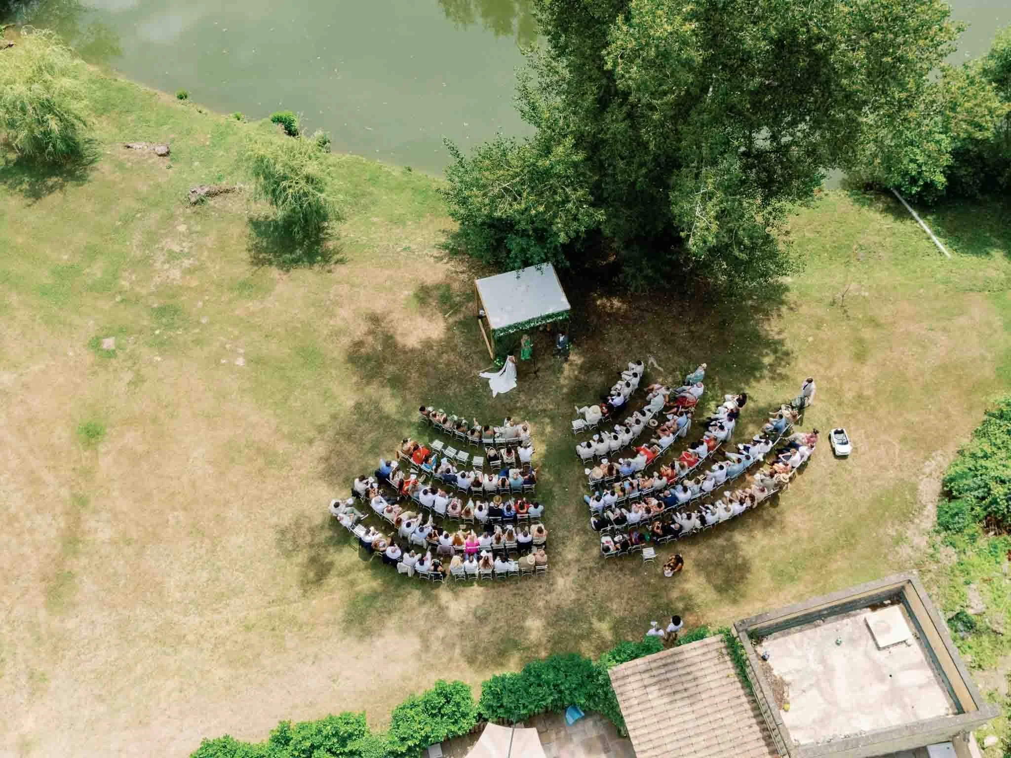 Aerial drone photograph of fan-shaped ceremony seating at Château Lagorce, Bordeaux