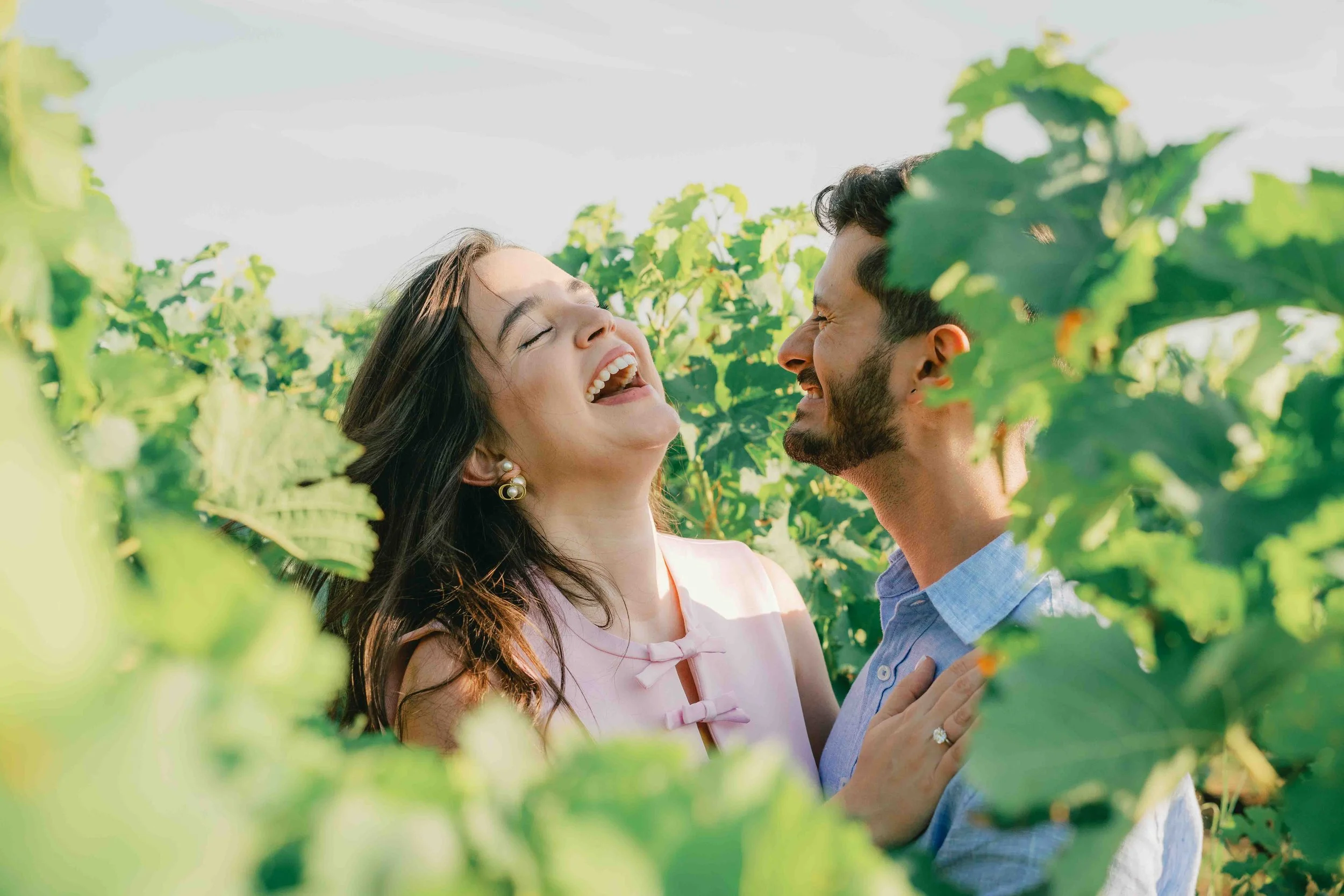Felipe and Sara laughing together at the hotel in Saint-Émilion after he proposed
