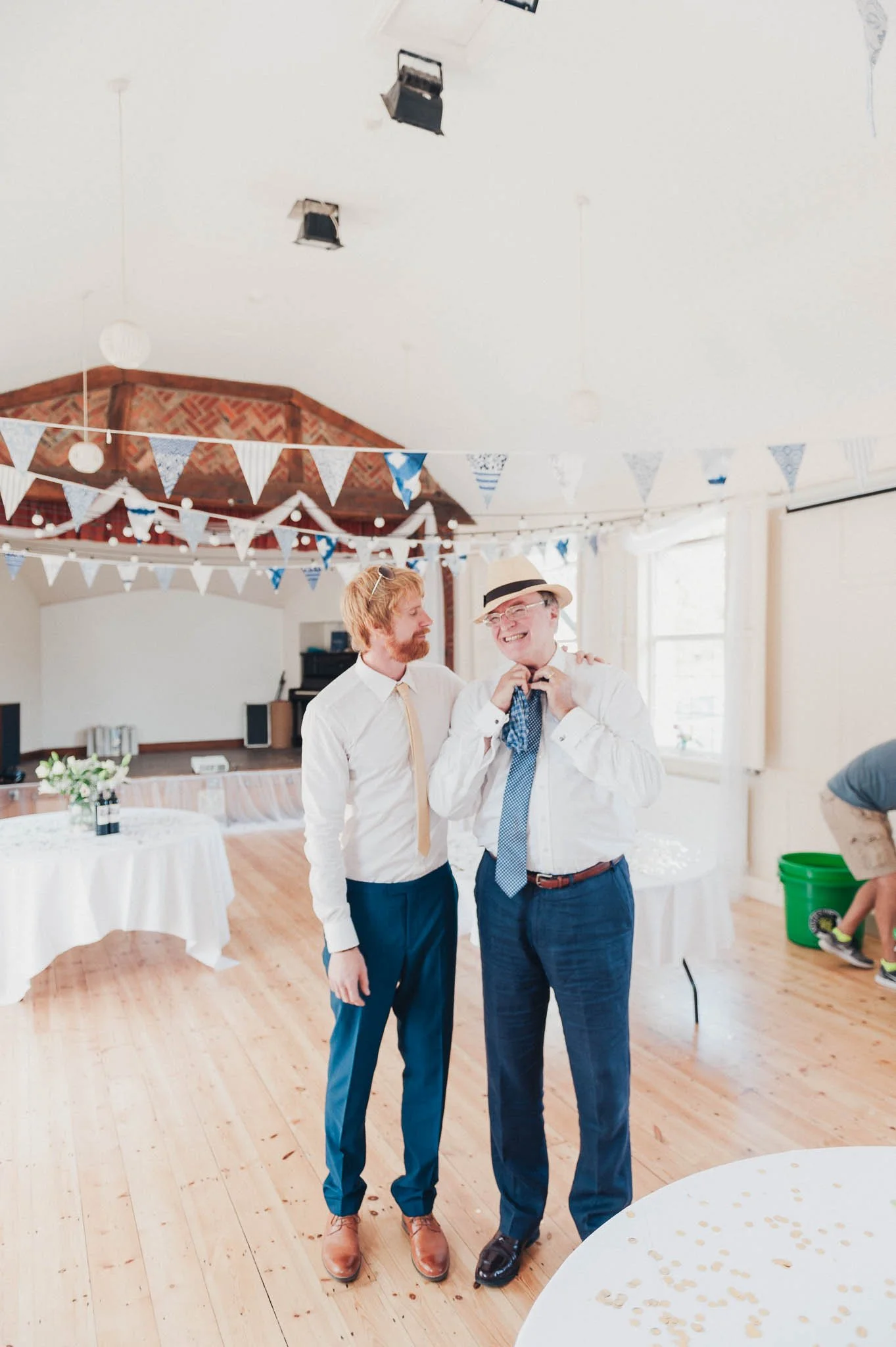 The groom with his father and best man posing together before the ceremony.