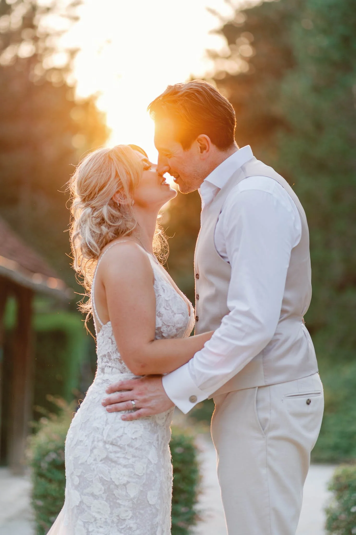 Bride and groom sharing a kiss at golden hour, Southwest France wedding photographer