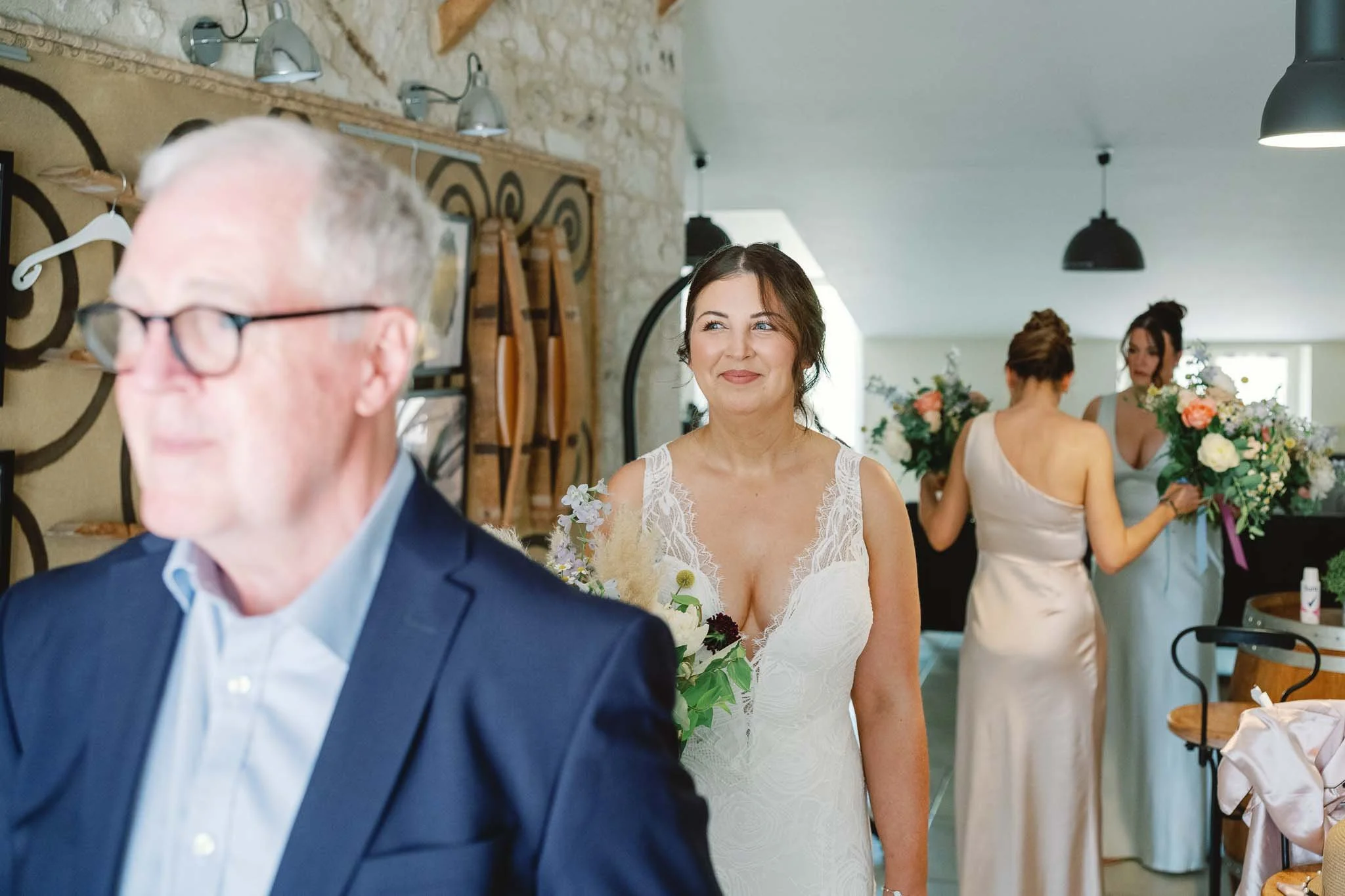 Bride and her father waiting to join the ceremony at Château de Panisseau, Dordogne