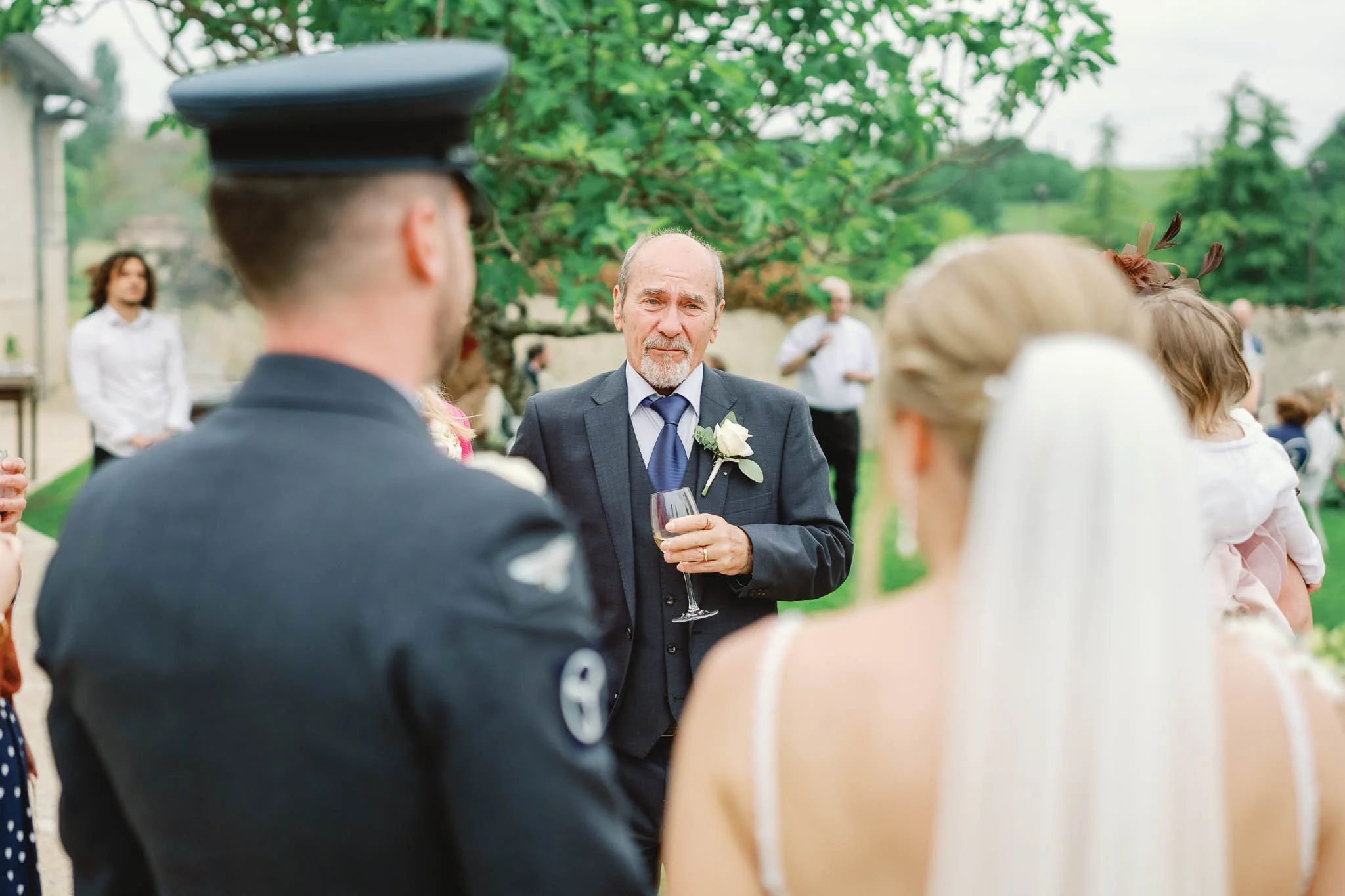 Guests watching the wedding ceremony with emotion, Southwest France wedding photography