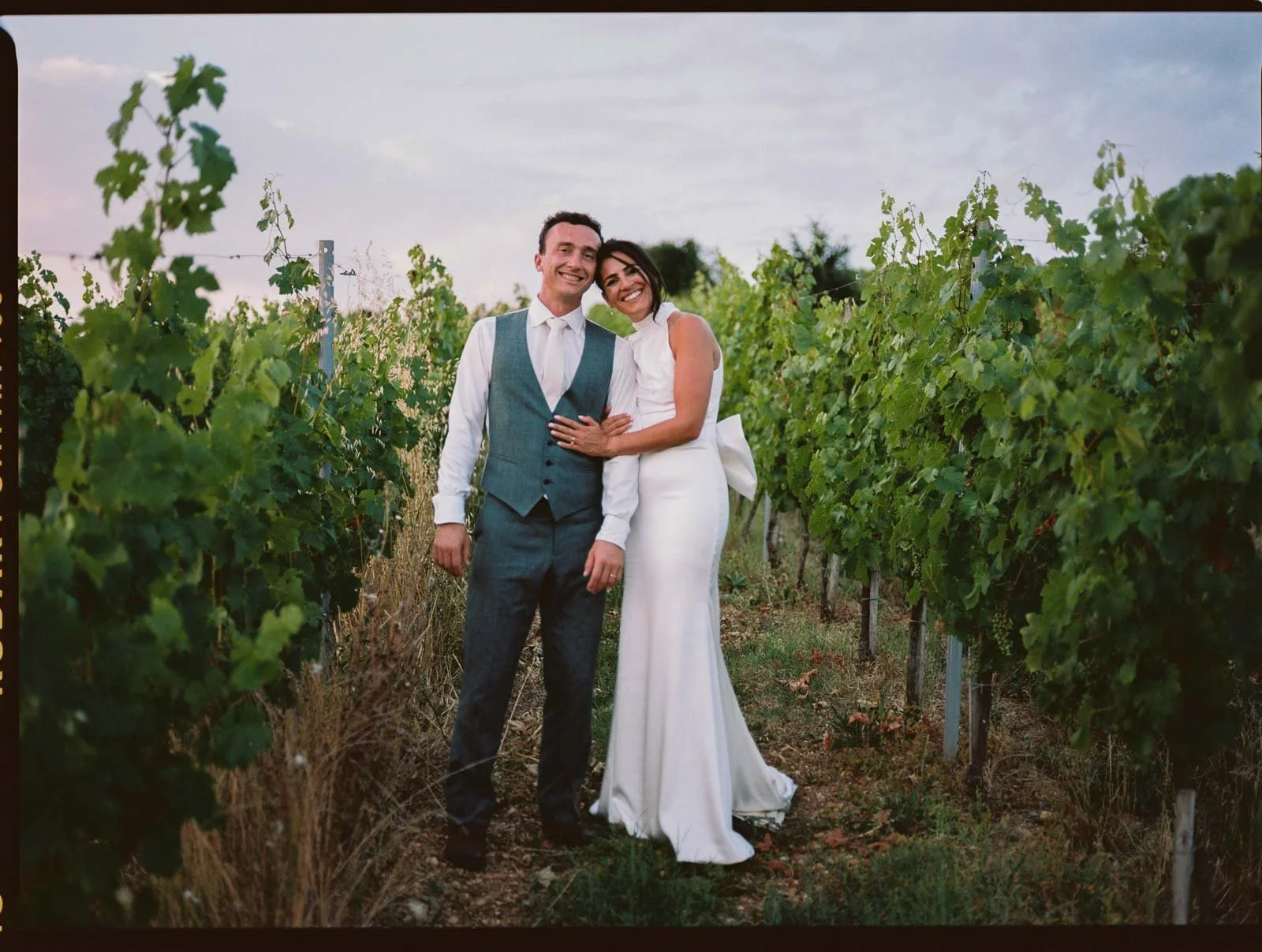 Film photograph of the bride and groom in the vineyard behind Château Lagorce