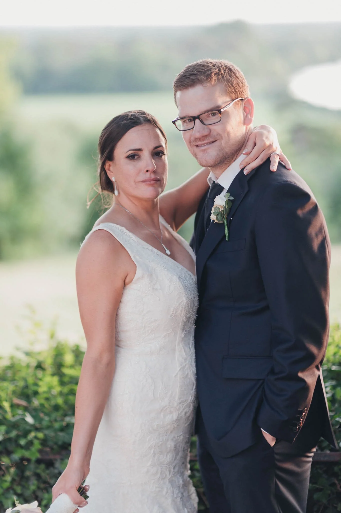 A relaxed portrait of the bride and groom outdoors after the ceremony.