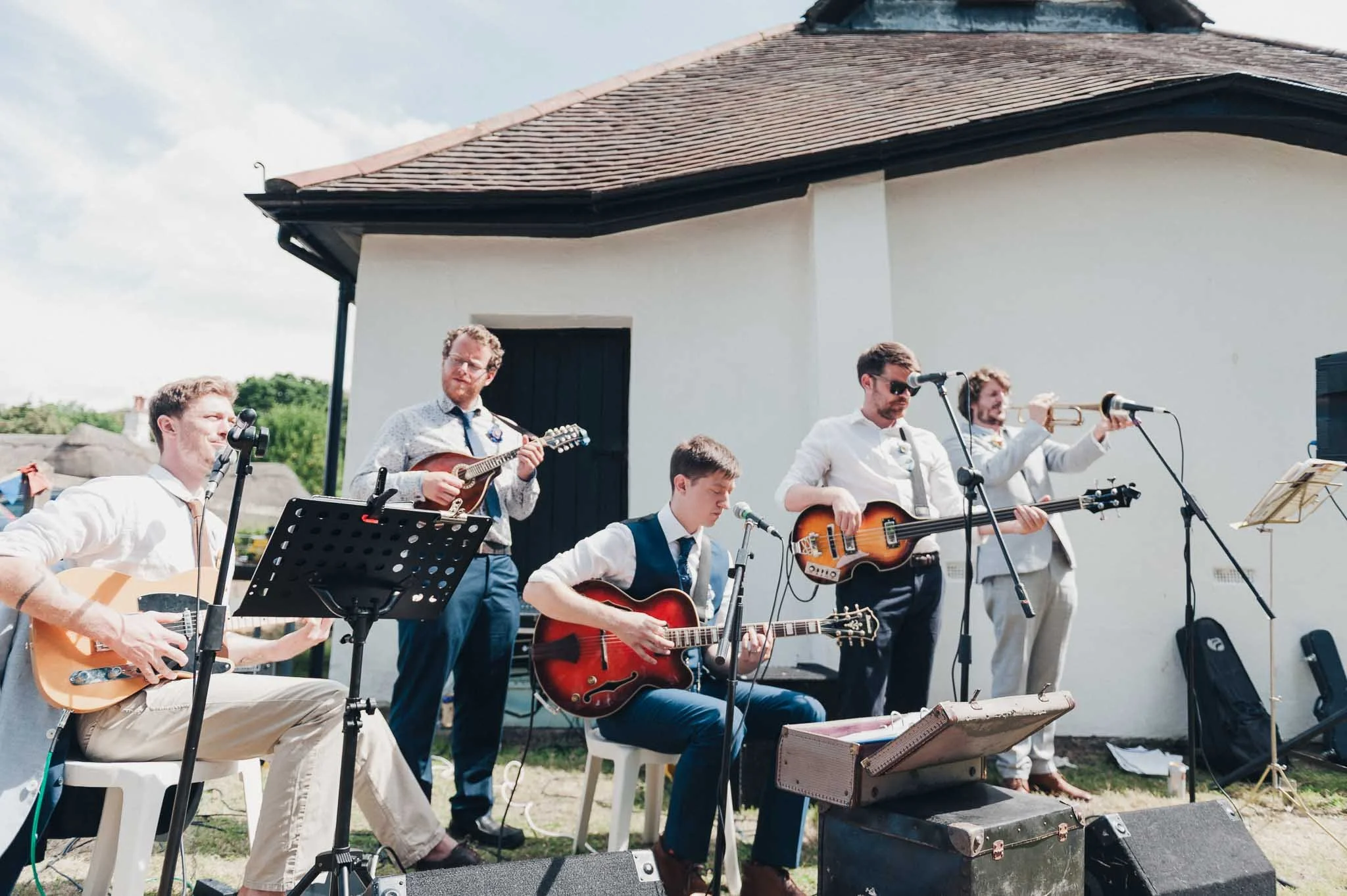 Live band performing outside the village hall during the drinks reception.