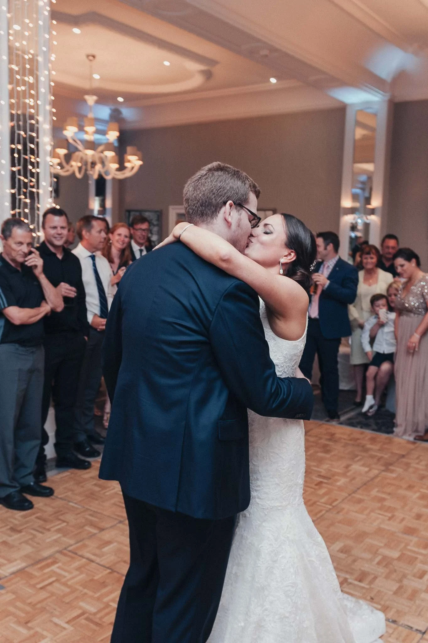 The bride and groom holding each other during their first dance at Richmond Hill Hotel.