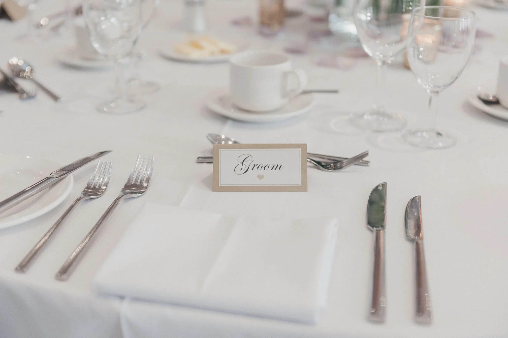 Place setting for the groom at the wedding breakfast table, photographed before guests arrived.