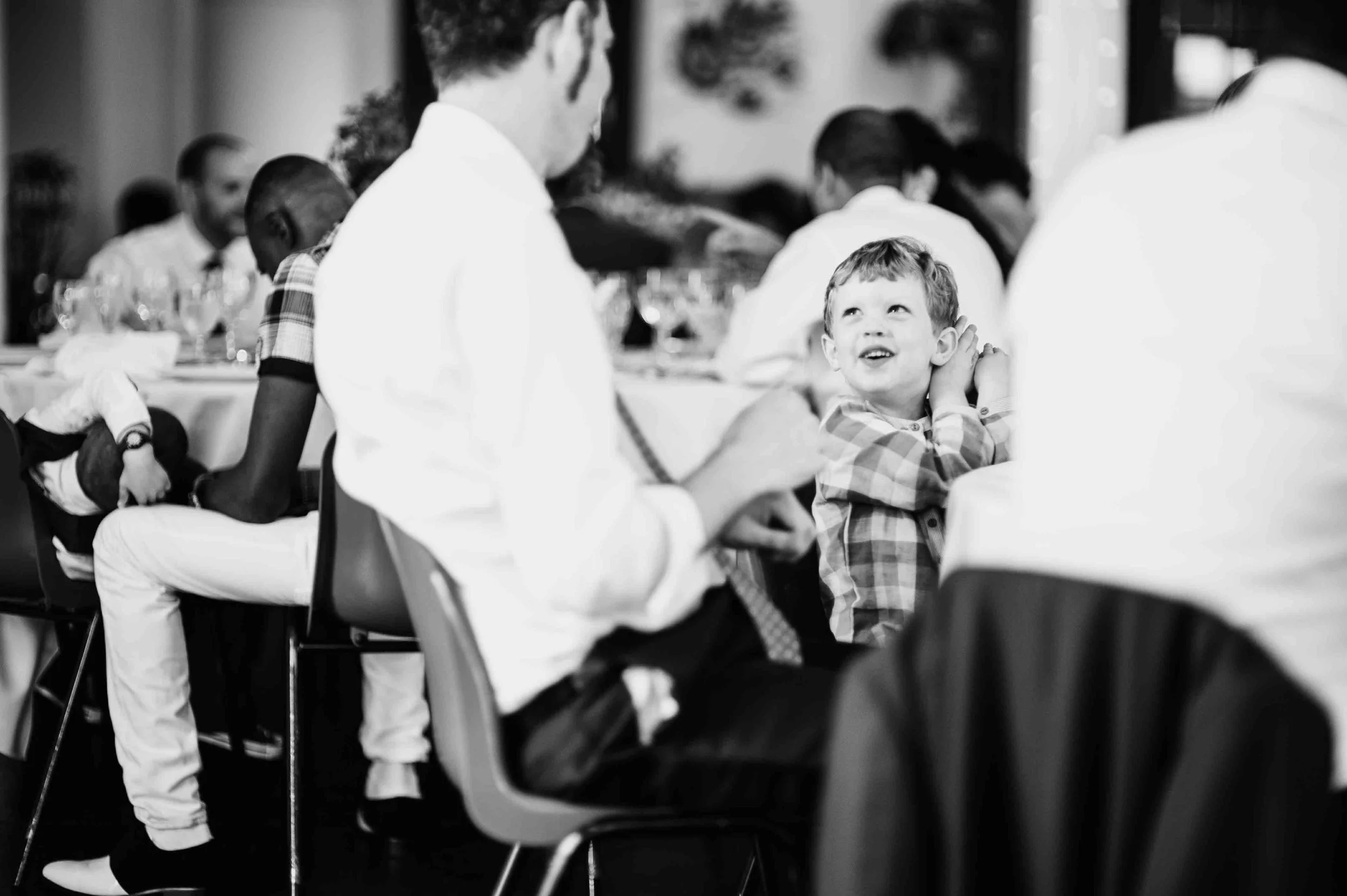 Close view of the couple holding hands during the ring exchange, captured calmly during the wedding ceremony.