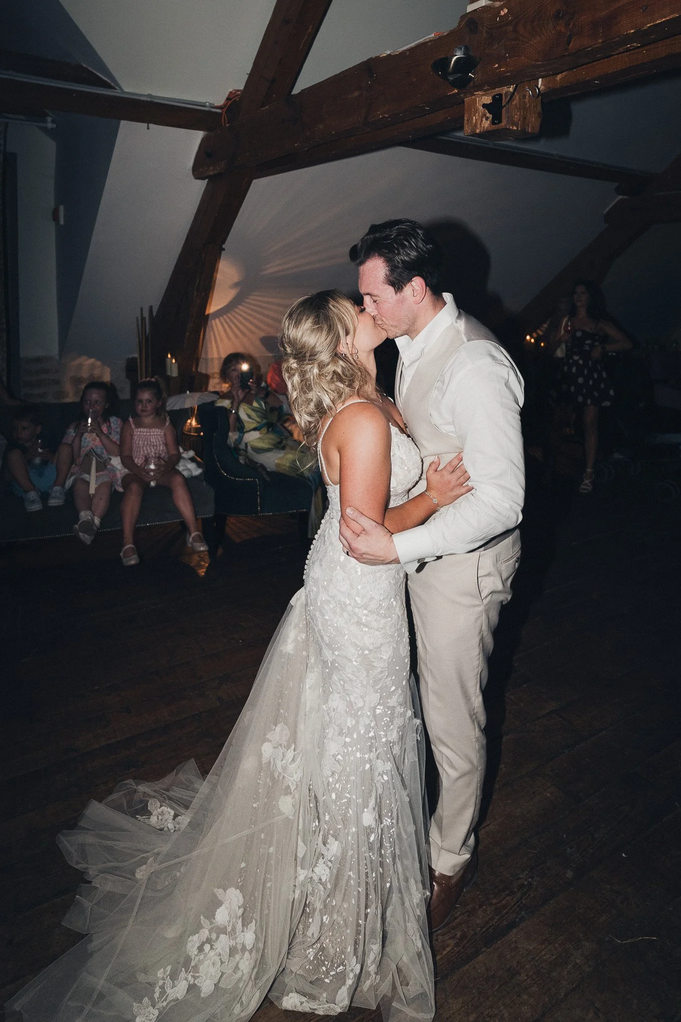 The couple sharing a quiet moment on the dance floor during their evening reception in France.