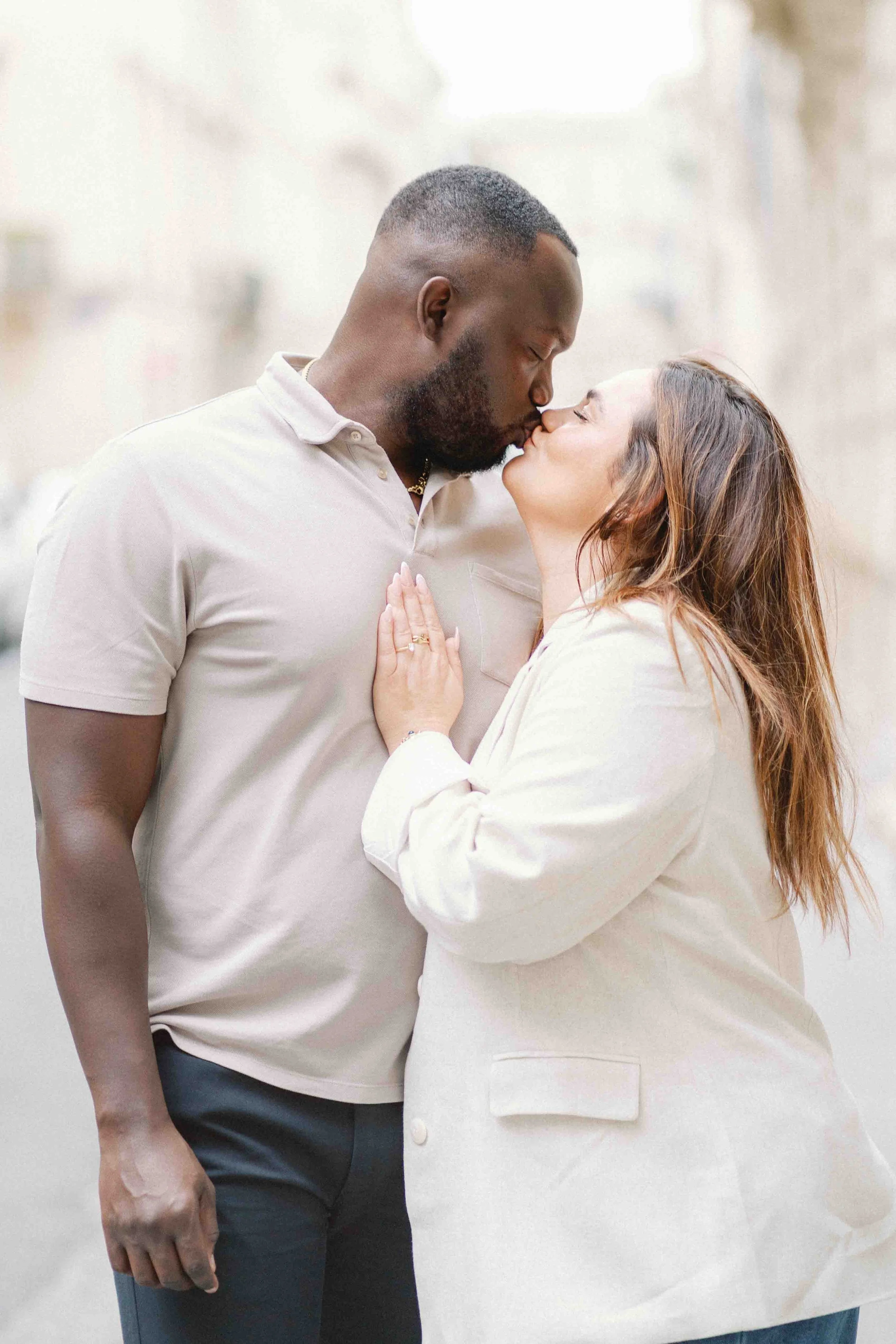Lesley and Gulsum kissing just after their surprise proposal in the Jardin Public, Bordeaux