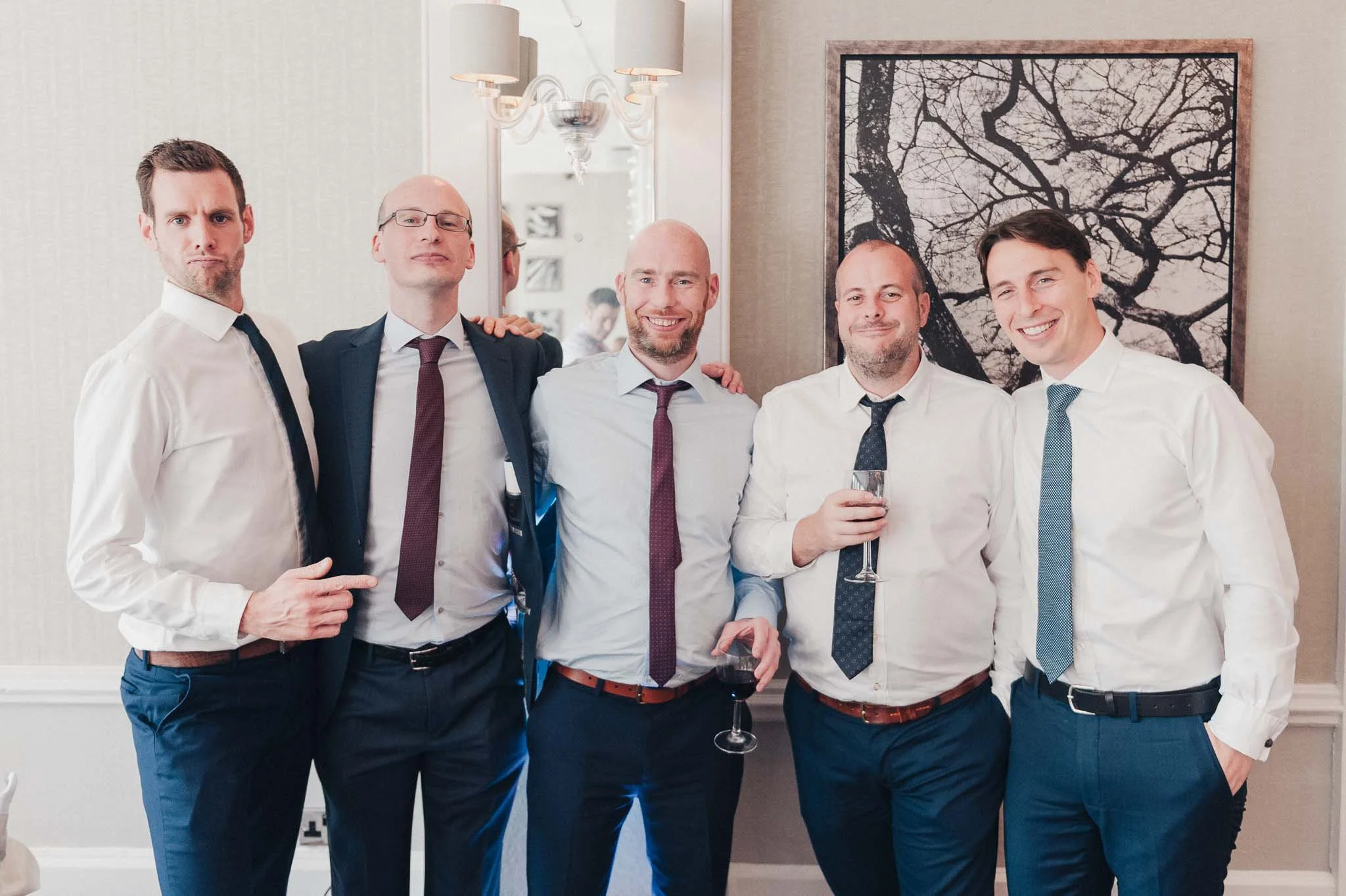 Group of male guests posing together during the wedding reception at Richmond Hill Hotel.