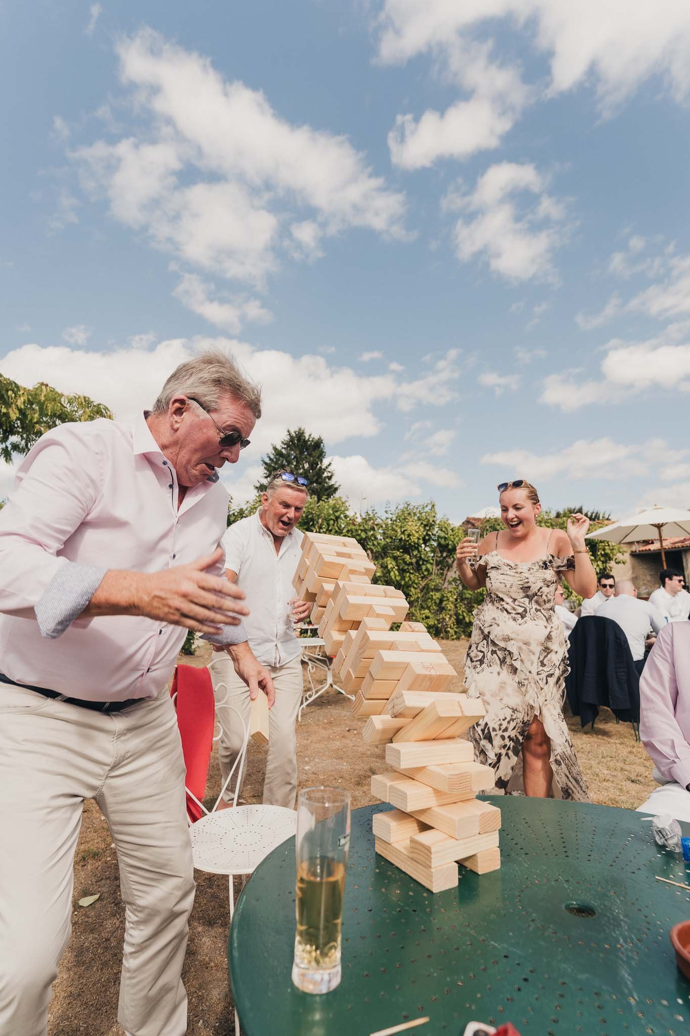 Guests playing Jenga during the afternoon reception.
