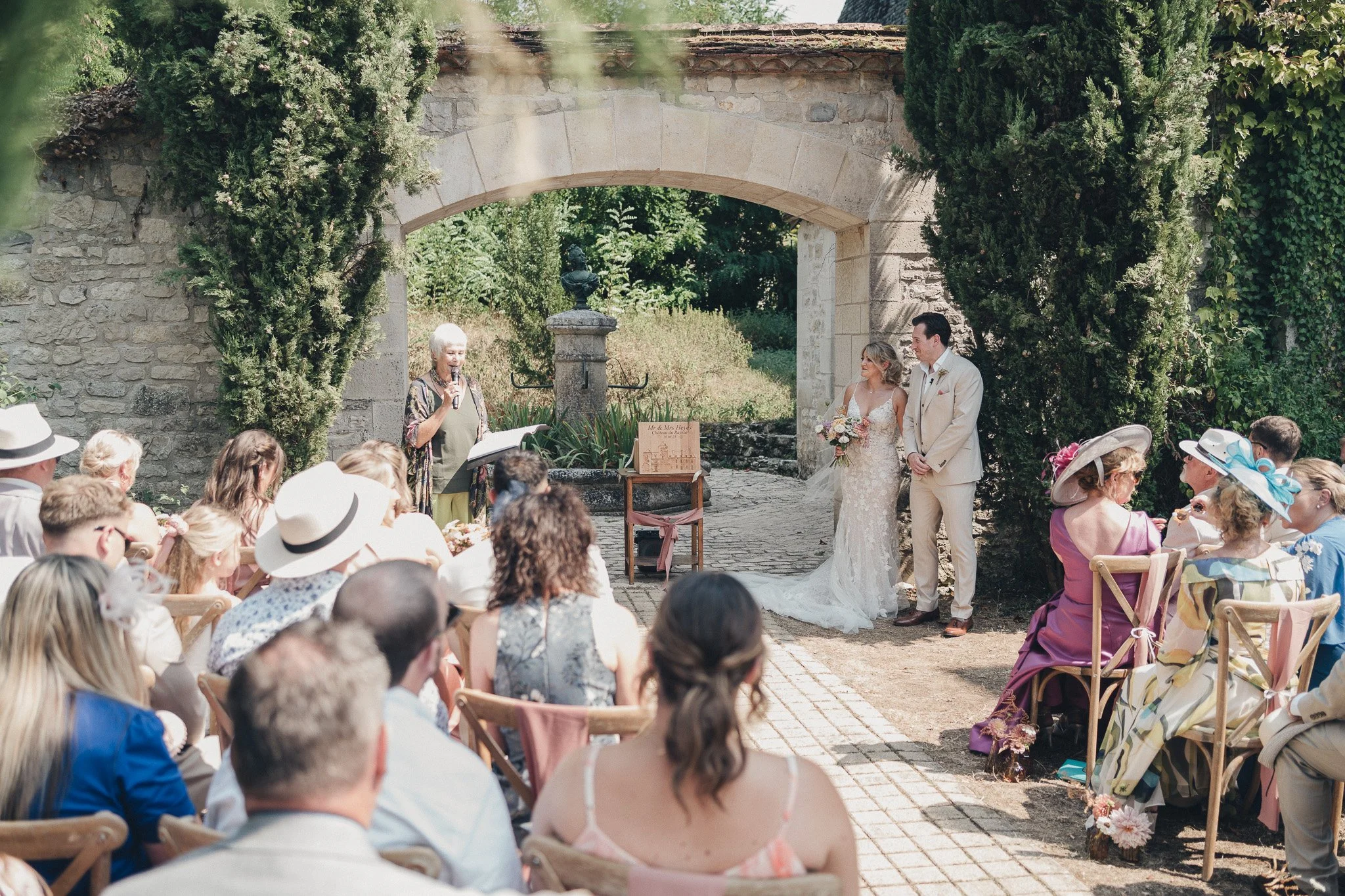 Wedding ceremony held outdoors at a château in southwest France.