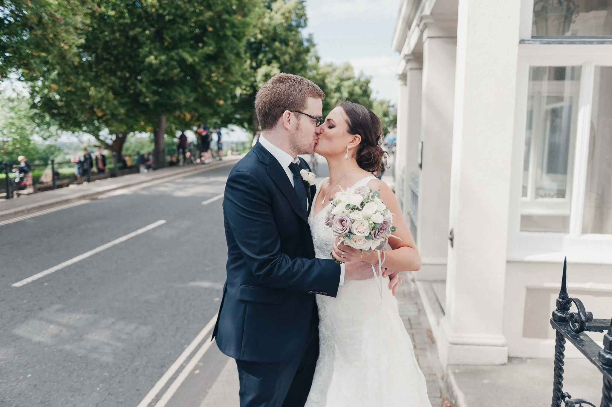 Bride and groom kissing outside the Richmond Hill Hotel shortly after the ceremony.
